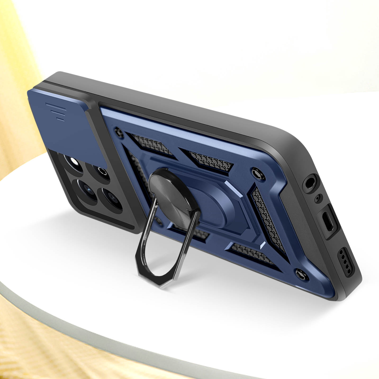 Una custodia per telefono blu e nera con supporto ad anello. Superficie bianca.