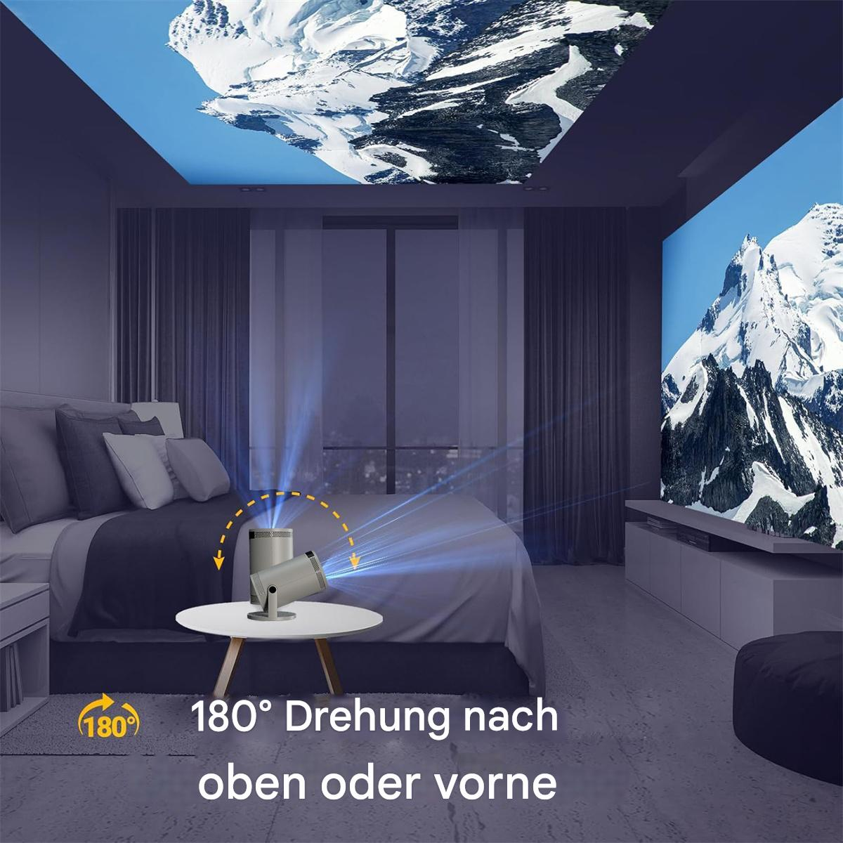 Ein Zimmer mit Bett, ein Projektor, der eine Bergszene auf Decke und Wand projiziert.