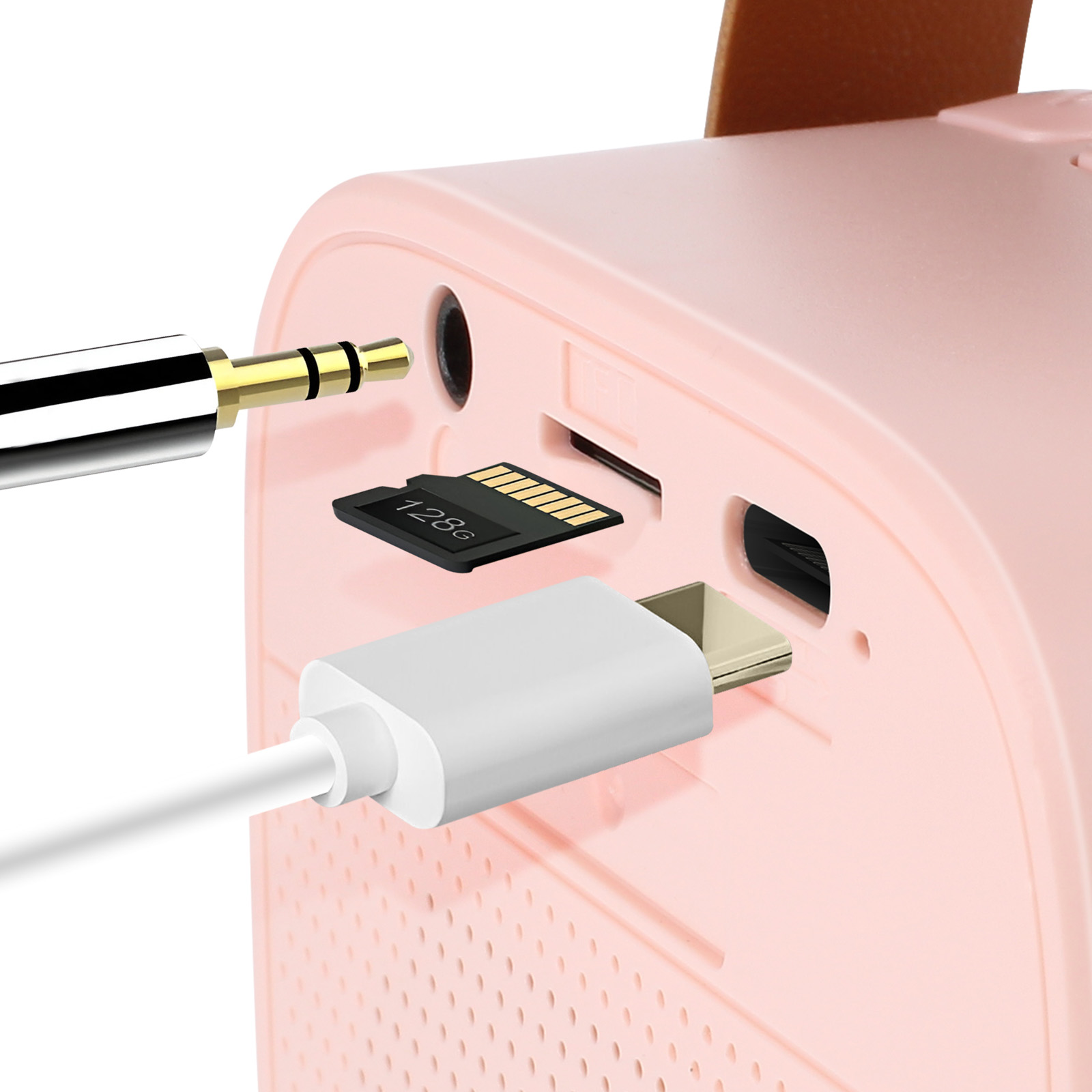 Primo piano di un altoparlante rosa con porte e cavi collegati. Cavo nero e dorato.
