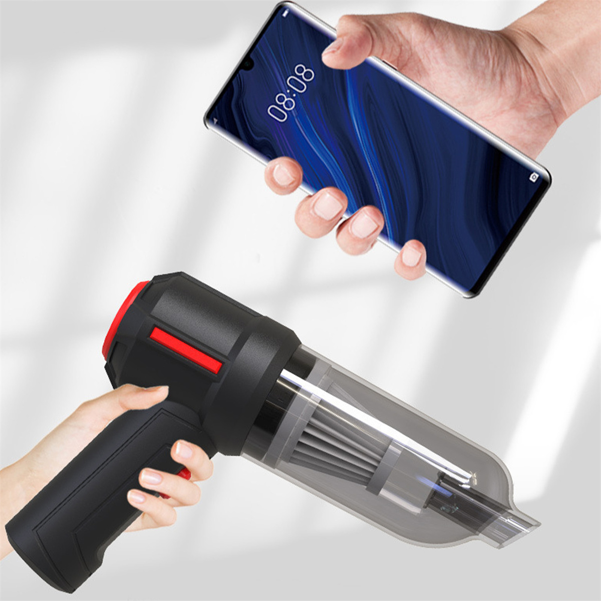 Hände halten ein Telefon und einen Handstaubsauger. Das Telefon zeigt einen Bildschirm und die Düse des Staubsaugers.