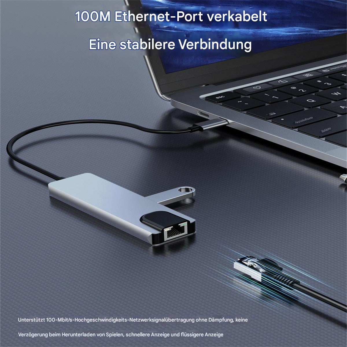 Laptop, der mit einem silbernen USB-Hub verbunden ist, in den ein Ethernet-Kabel eingesteckt ist.