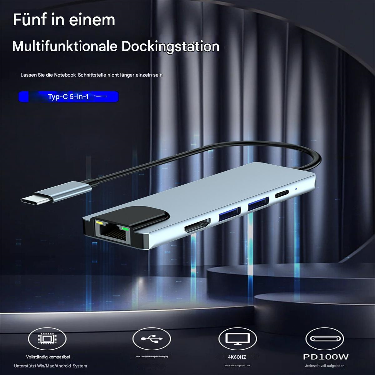 Eine silberne Dockingstation mit mehreren Anschlüssen, einem Typ-C-Anschluss und Text, 5-in-1.