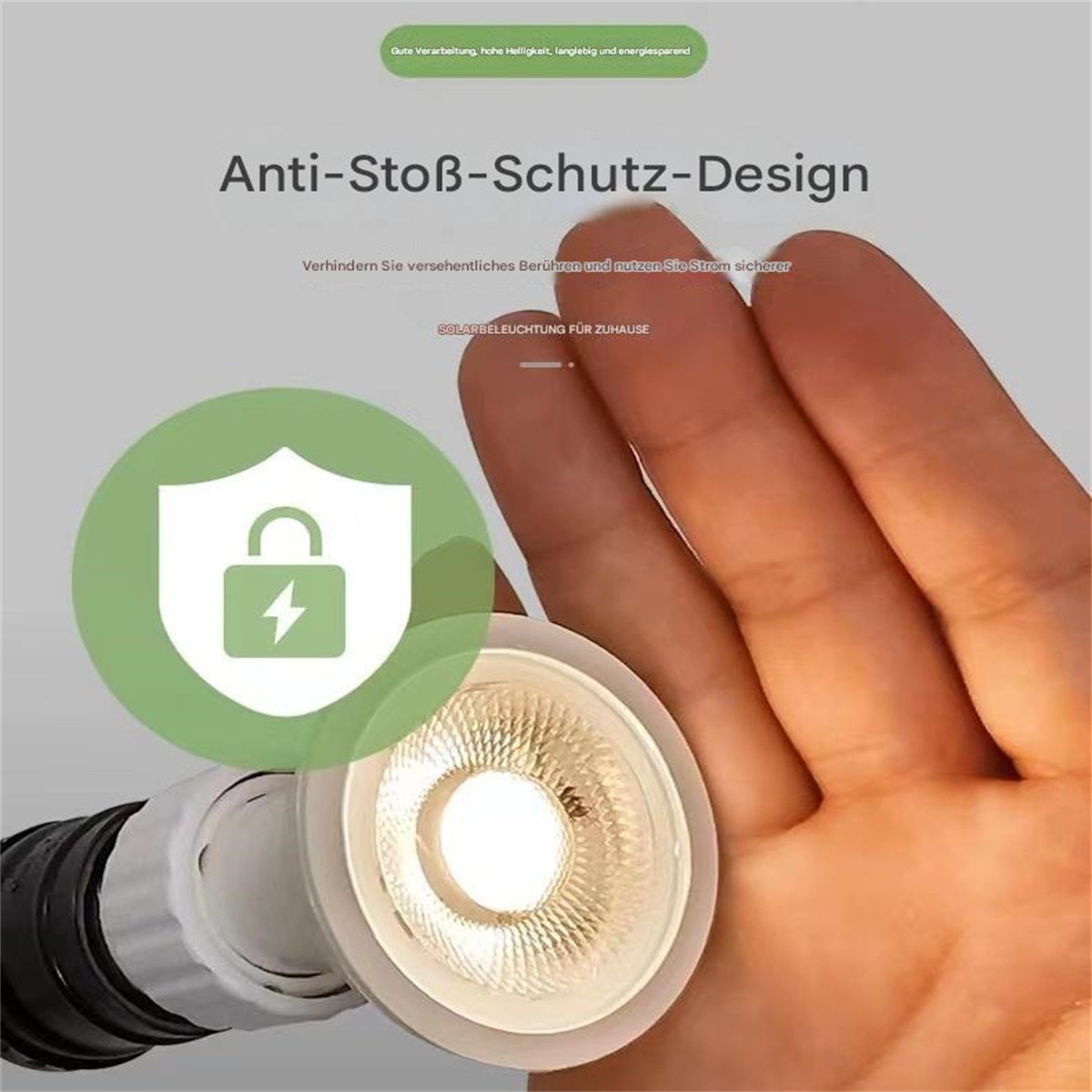 Hand berührt einen Strahler mit Text über Anti-Stoß-Schutz.