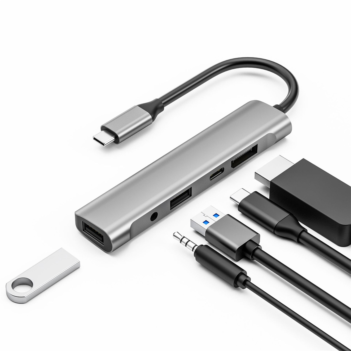 Ein silberner Hub mit verschiedenen Anschlüssen und angeschlossenen Kabeln, einschließlich USB und HDMI.