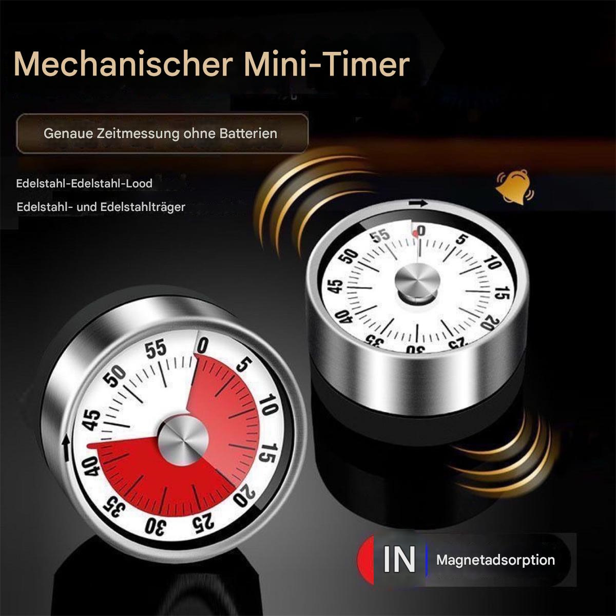 Zwei mechanische Timer mit Zifferblättern. Einer zeigt die Zeit.