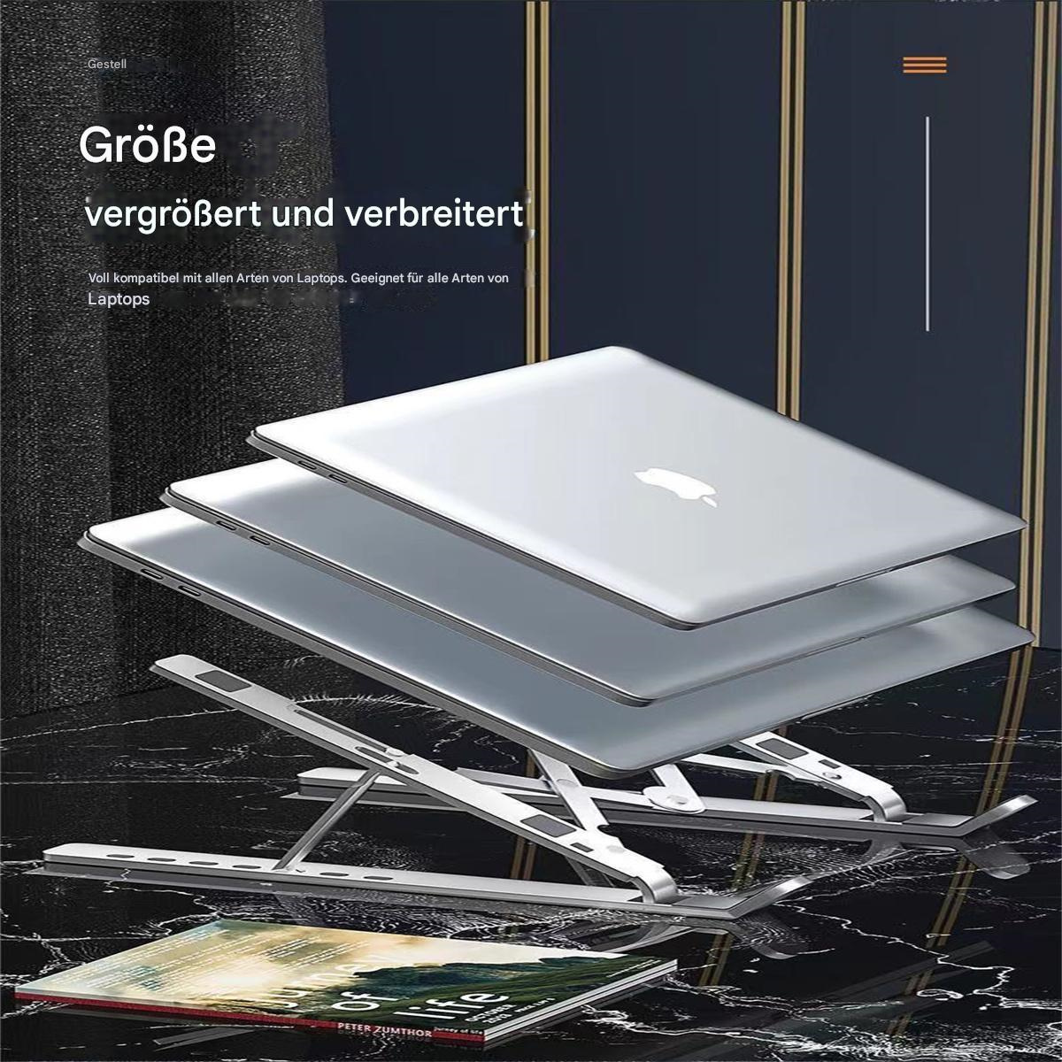 Silberne Laptops auf einem Metallständer, mit deutschem Text und einem Buch im Hintergrund.