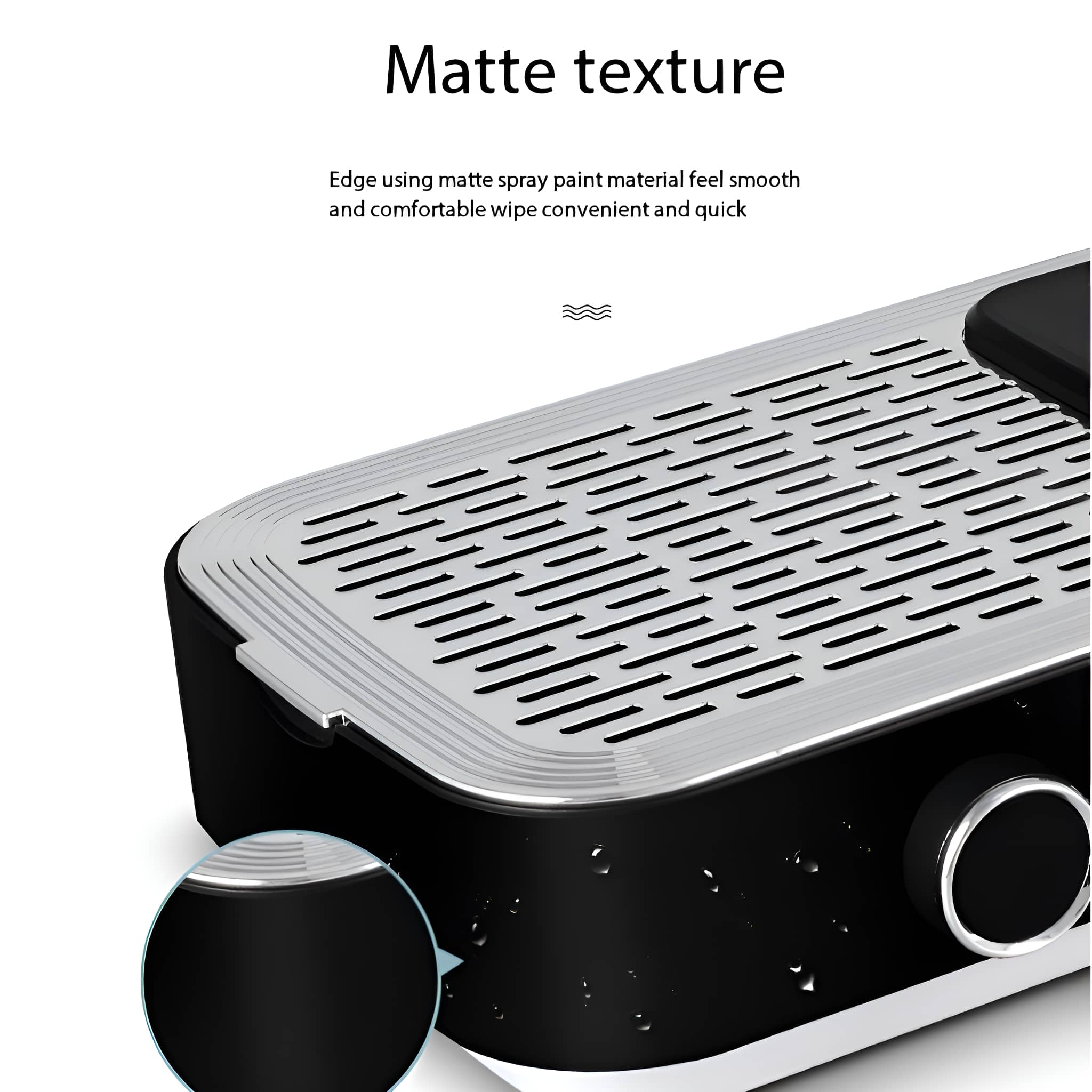 Nahaufnahme eines schwarzen und silbernen Tabletts, mit matter Textur und einem runden Drehknopf.