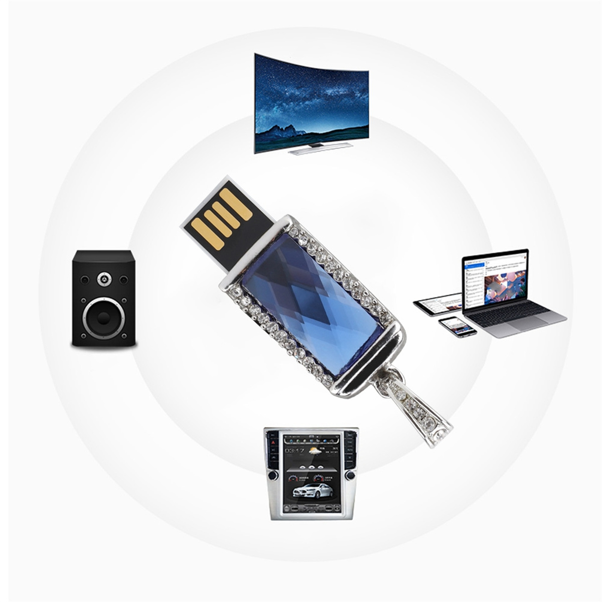 USB-Stick mit blauem Schmuckdesign, umgeben von elektronischen Geräten.