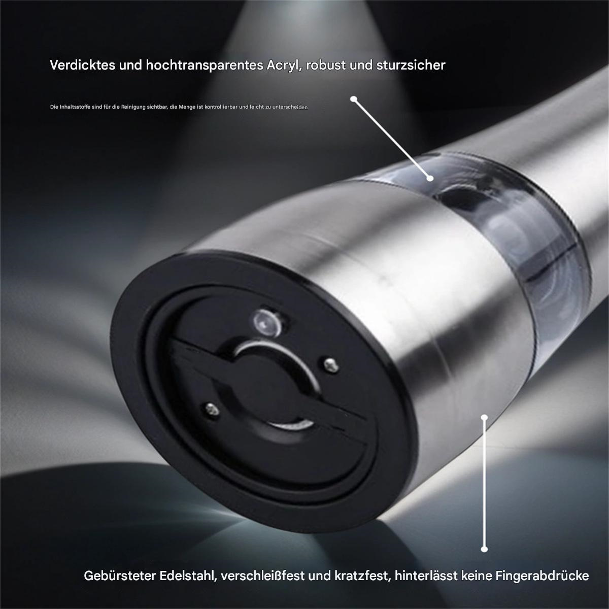 Nahaufnahme eines elektrischen Pfeffermühlen aus Edelstahl. Es hat einen transparenten Acrylbehälter und einen schwarzen Boden.