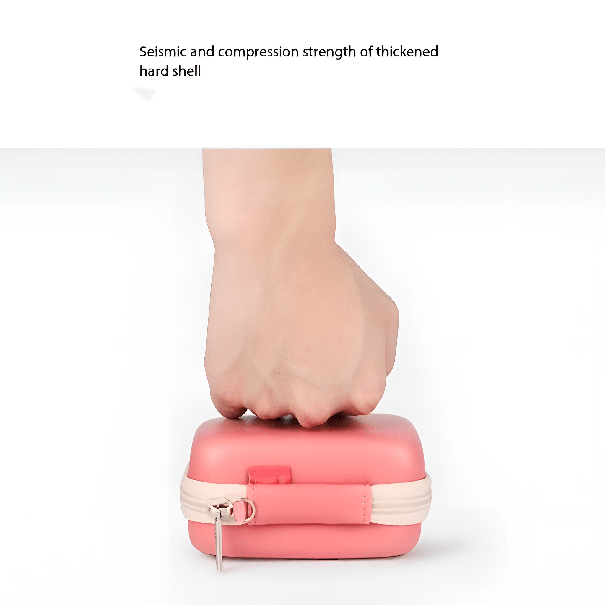 Hand drückt eine rosa Hülle. Der Text sagt: seismische und Druckfestigkeit der gehärteten Schale.