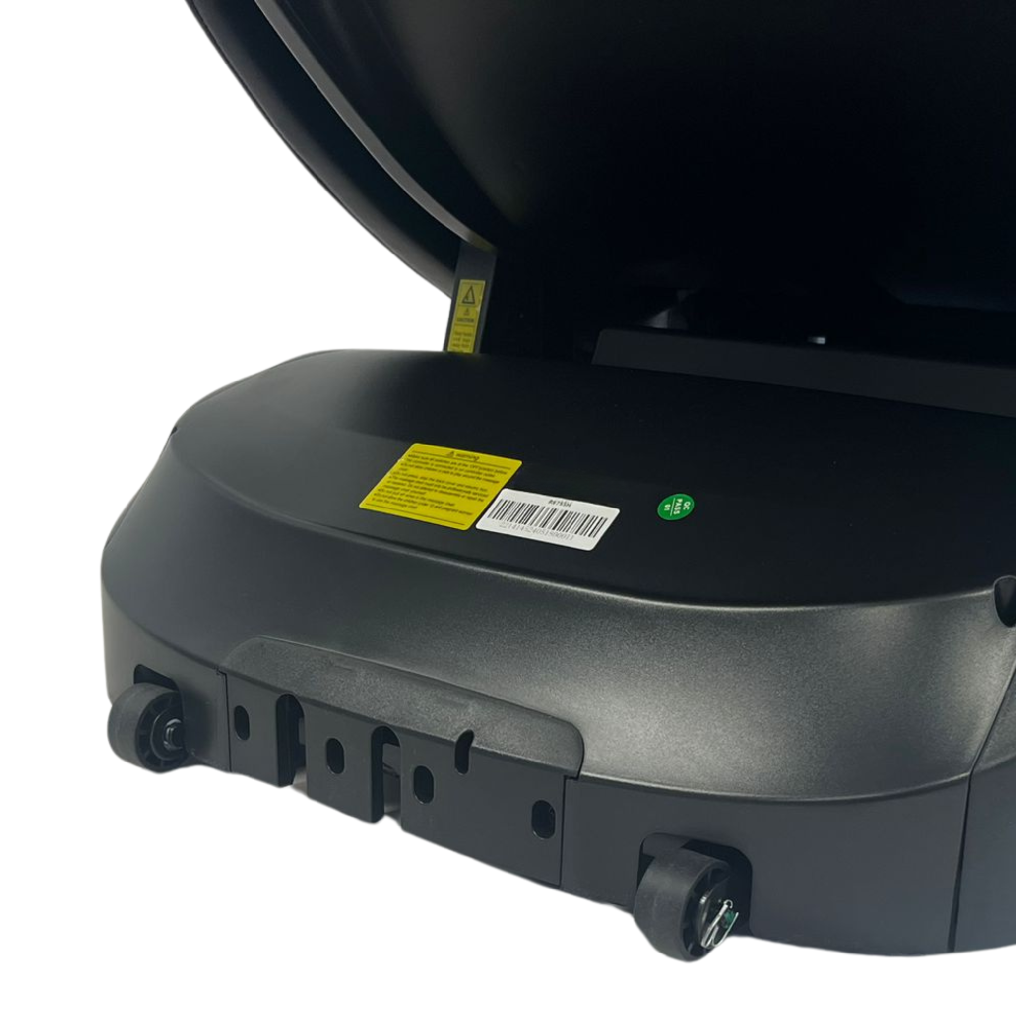 The bottom of a black device on wheels. There are labels and markings, showing it is a machine.