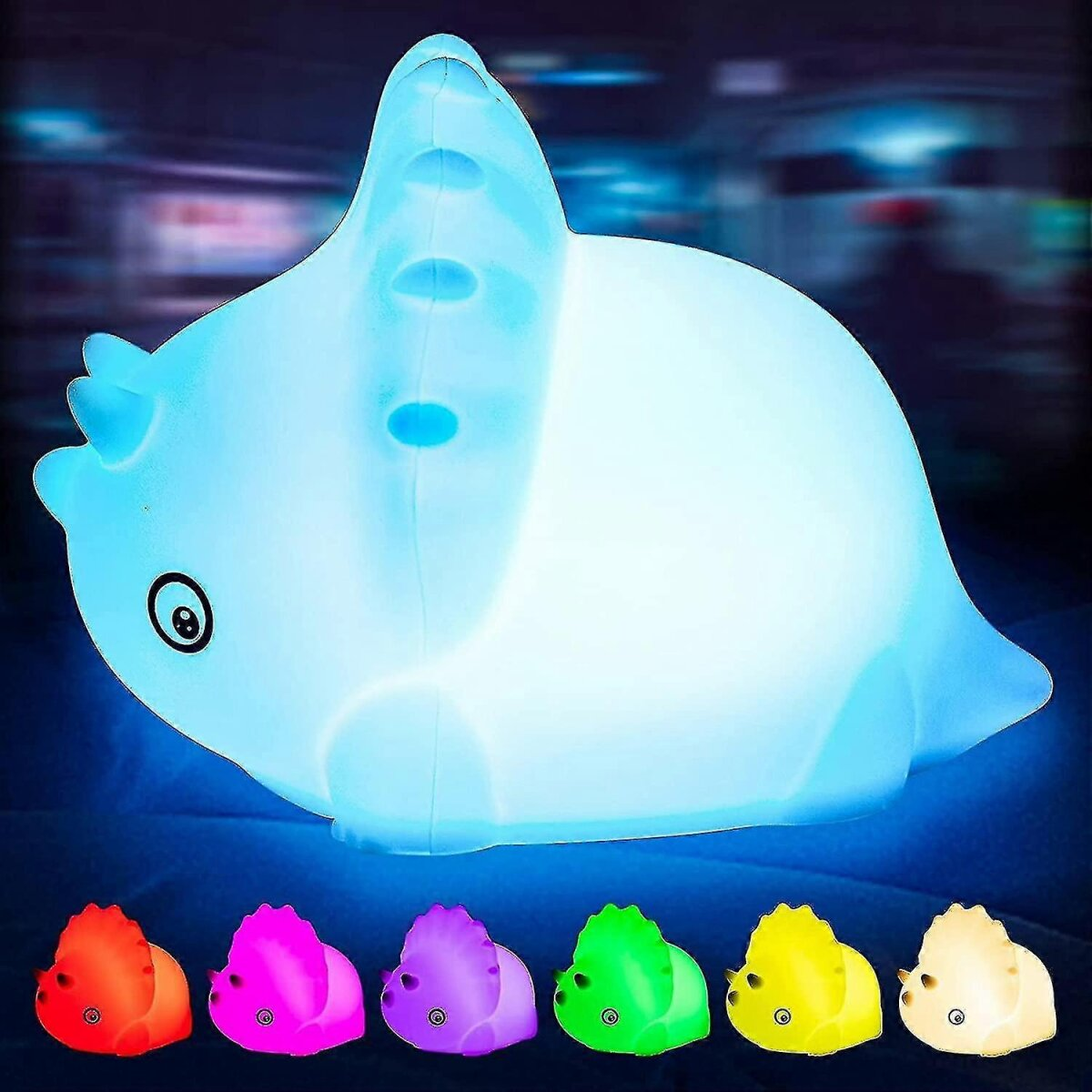 Ein blau leuchtendes Dinosaurier-Nachtlicht mit bunten, kleineren Dinosaurier-Lichtern darunter.