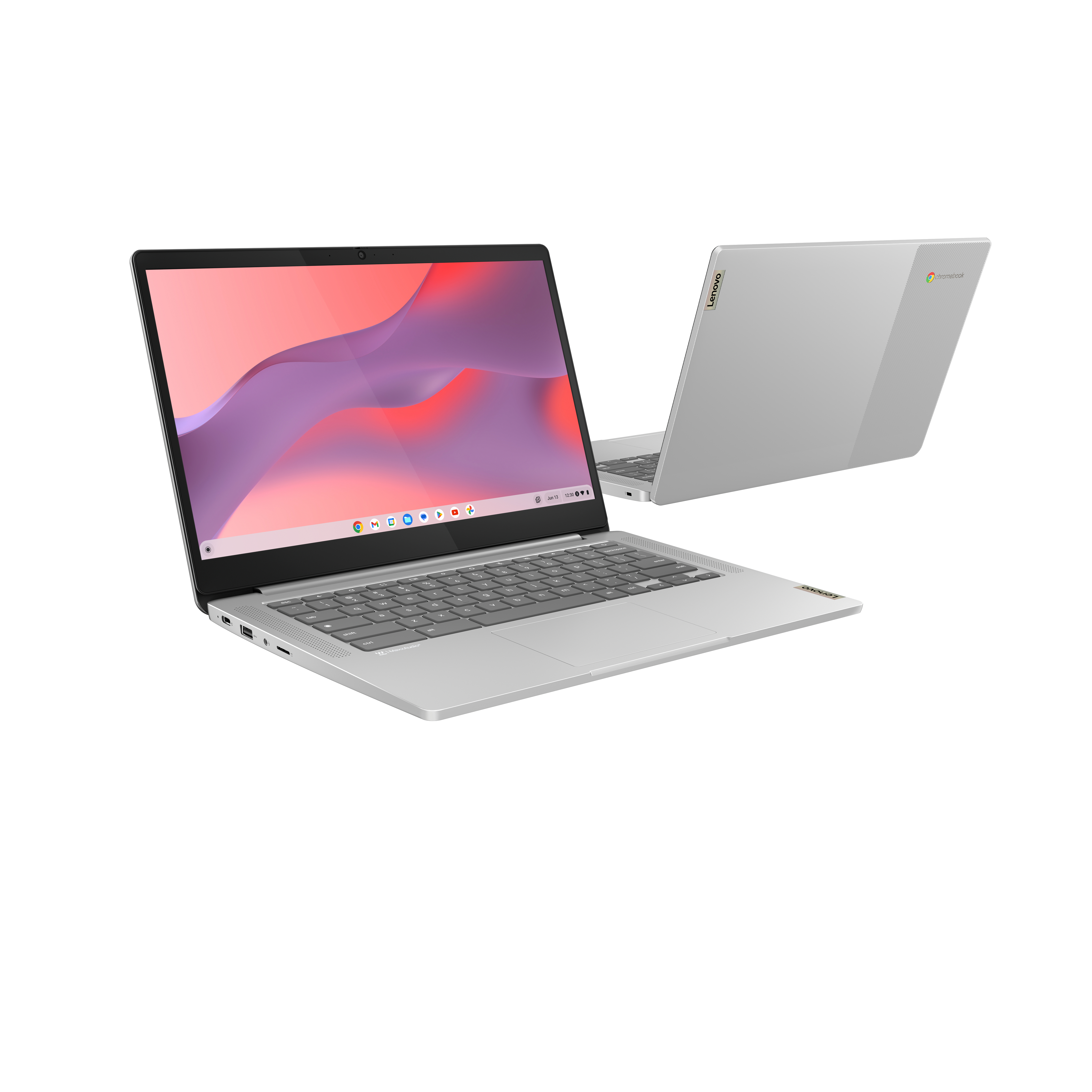 Srebrny laptop Lenovo Chromebook, otwarty, pod kątem, aby pokazać ekran i klawiaturę, z innym laptopem z tyłu.
