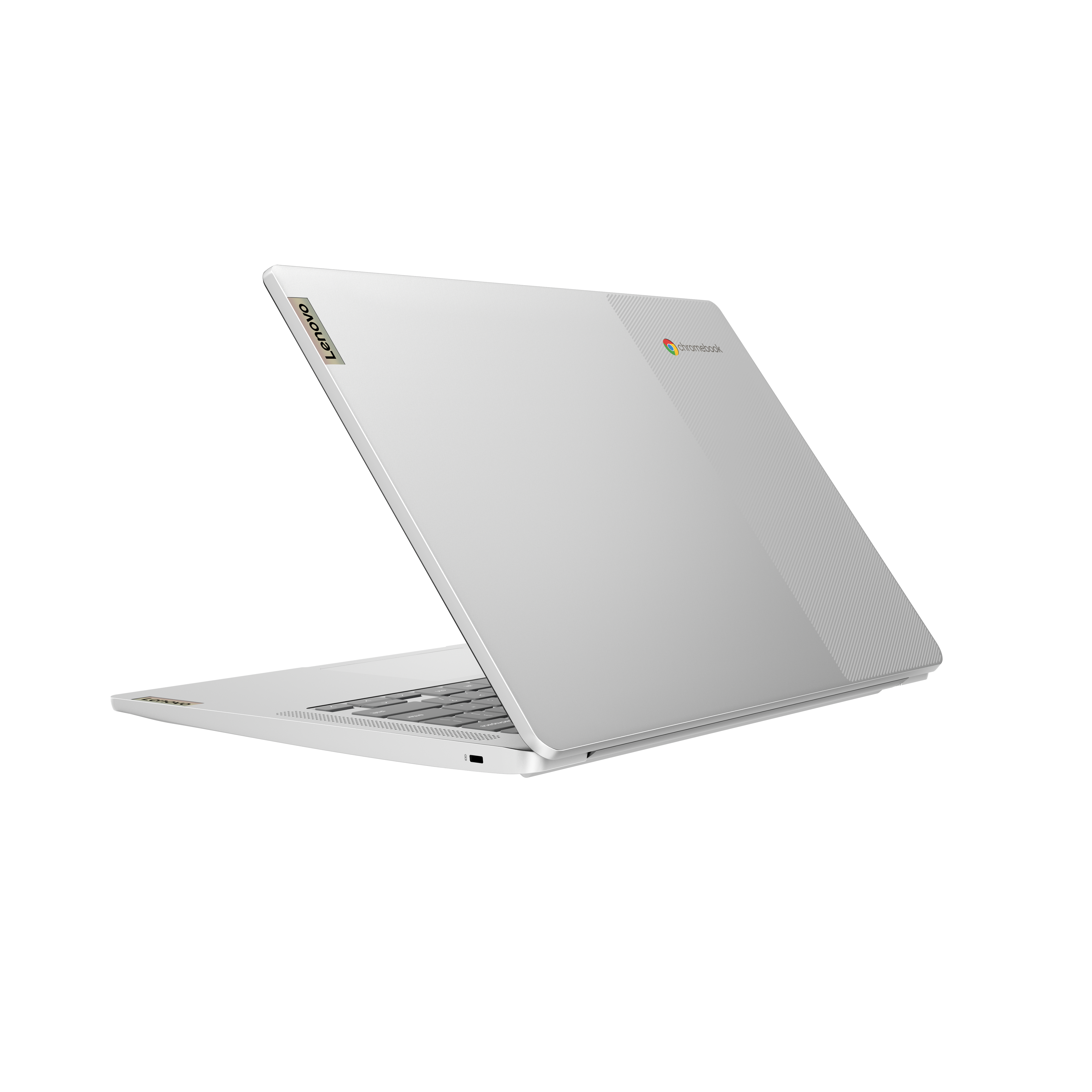 Biały laptop Lenovo Chromebook, lekko otwarty, pokazujący klawiaturę i logo Chrome na pokrywie.