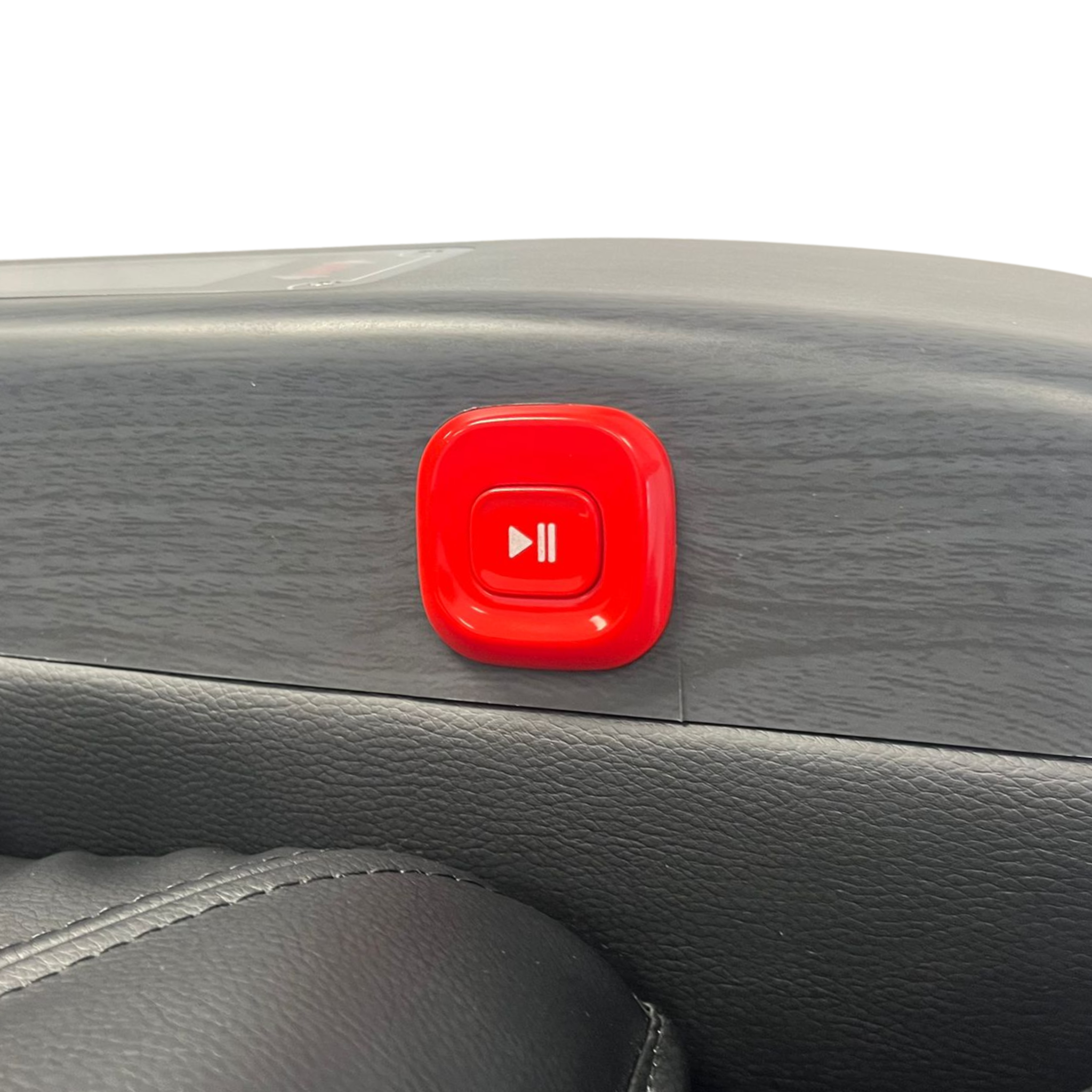 Red, square button with play/pause symbol, on a dark gray dashboard.