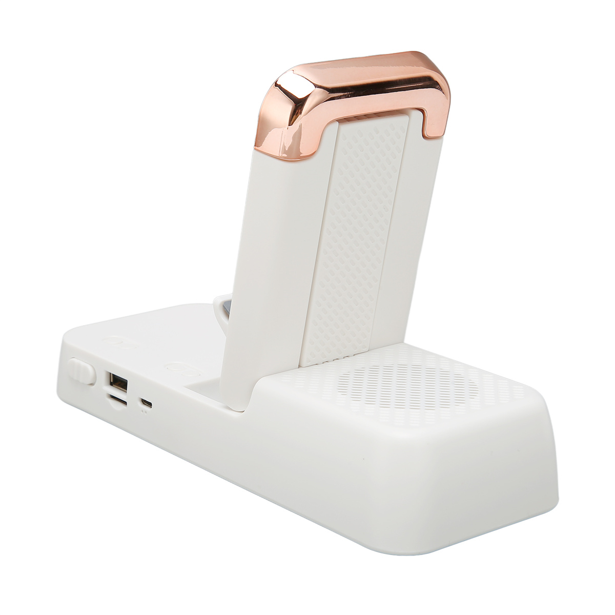 Eine weiße Ladestation mit einem Telefon. Die Oberseite hat einen roségoldenen Akzent.