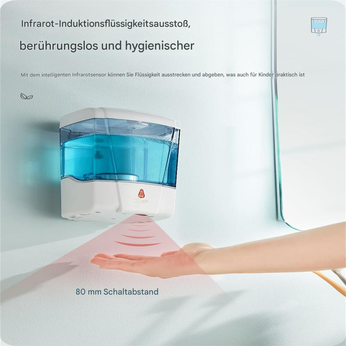 Ein automatischer Händedesinfektionsmittelspender an einer Wand, mit einer Hand.