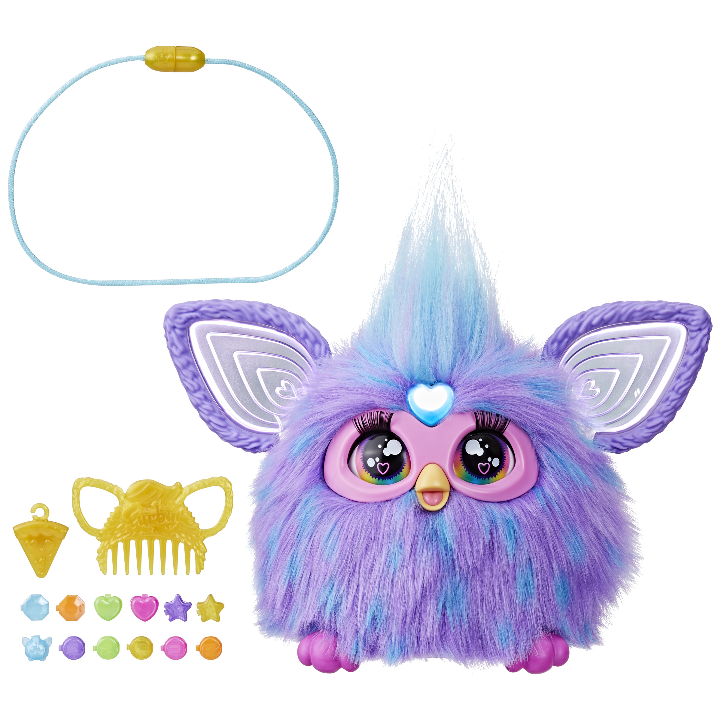Un juguete Furby con accesorios sobre un fondo blanco.