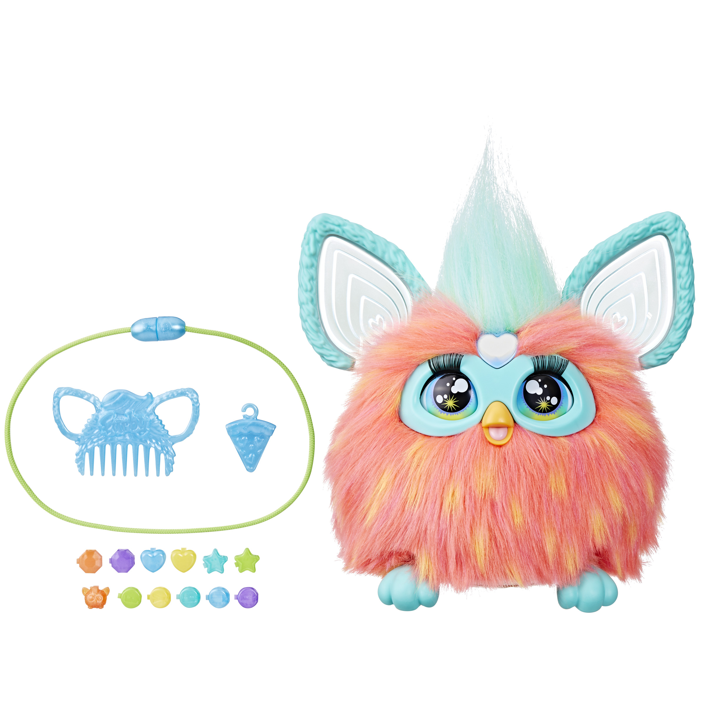 Un juguete Furby rosa con detalles azules, accesorios alrededor: un peine, cuentas y una pulsera.