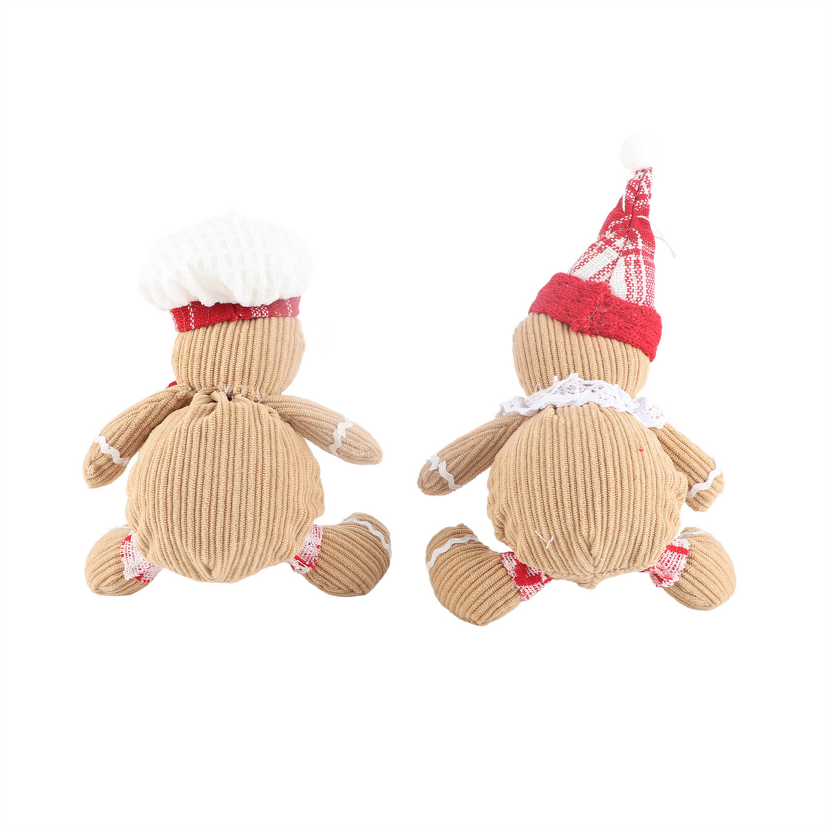 Zwei Lebkuchenmännchen-Puppen mit Kochmütze und Weihnachtsmütze auf weißem Hintergrund.