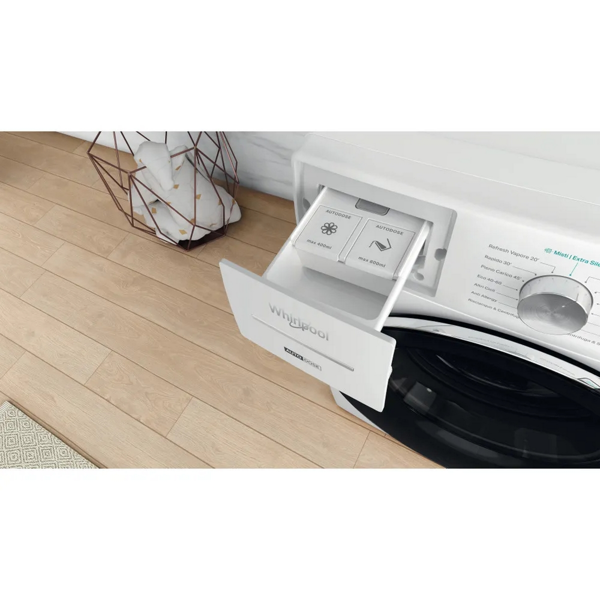 Cassetto lavatrice Whirlpool bianco aperto.