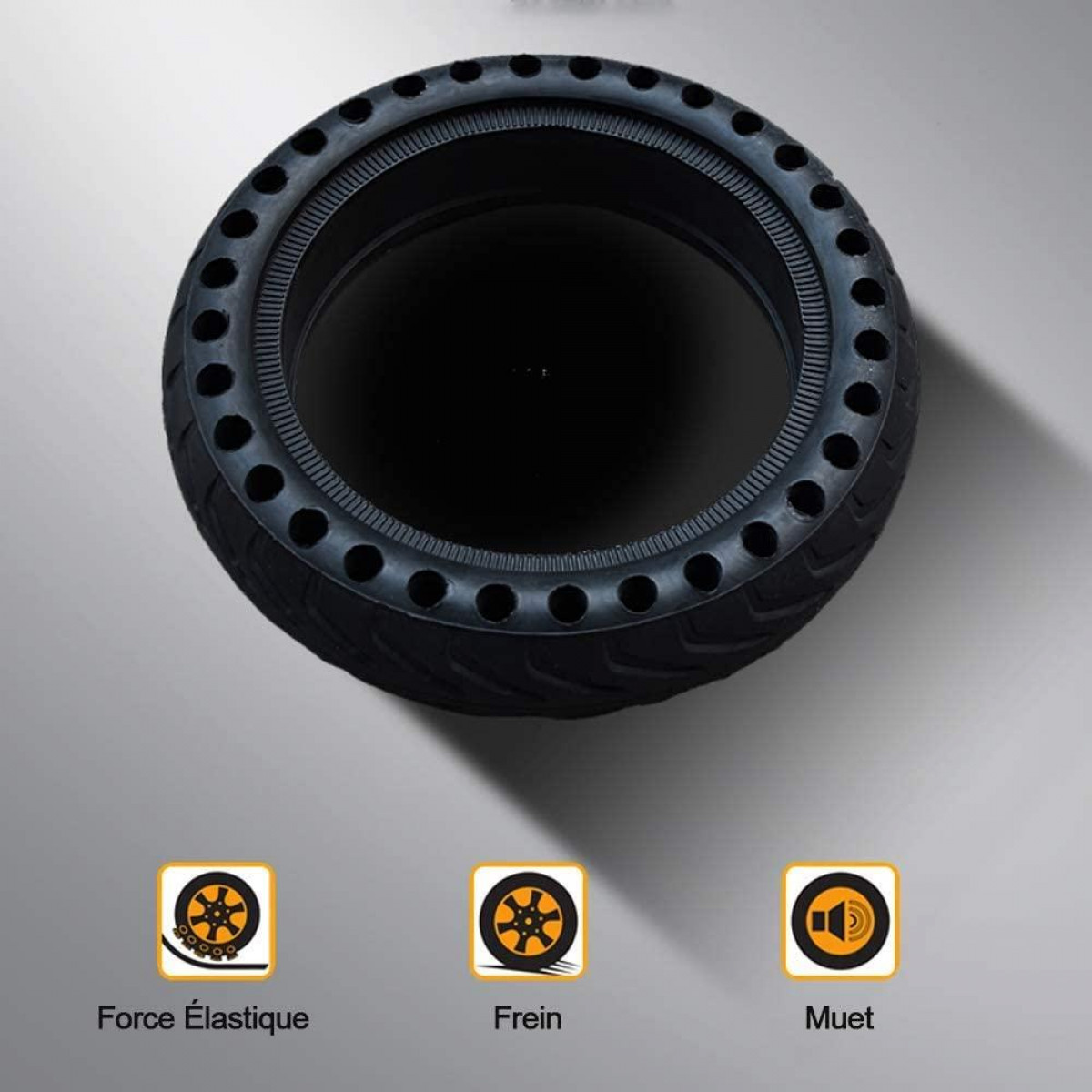 Czarna opona z otworami, z trzema ikonami związanymi z siłą, hamulcem i wyciszeniem.