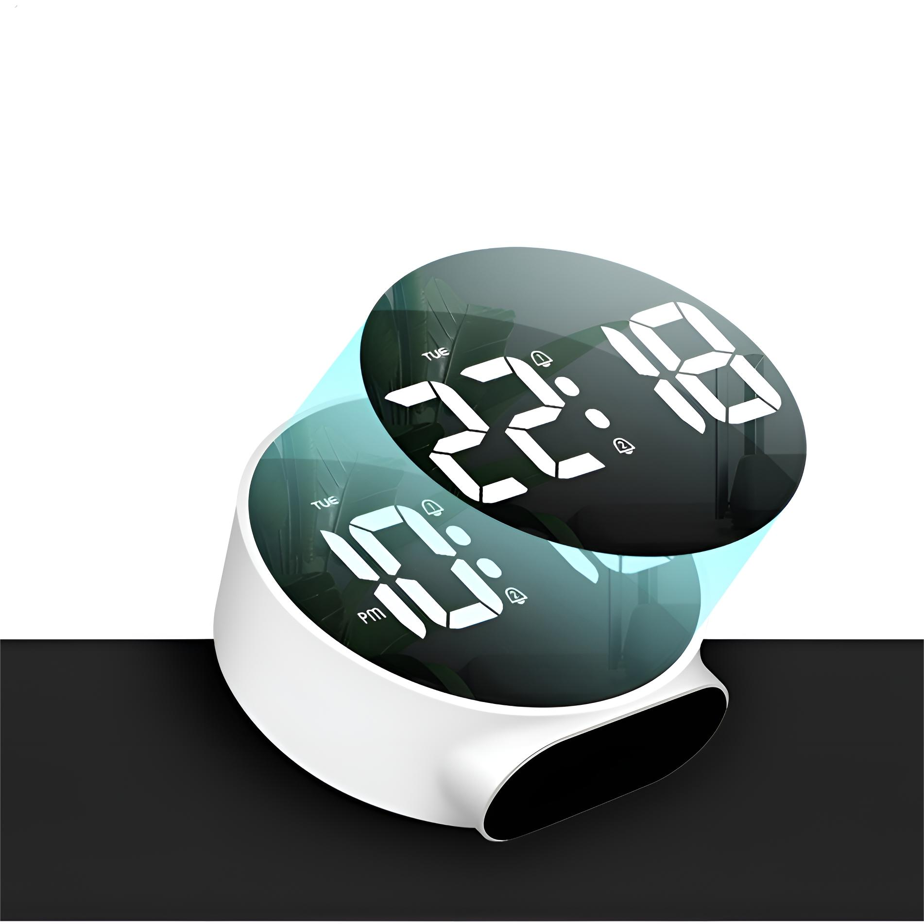 Eine weiße Digitaluhr mit schwarzem Hintergrund, die die Zeit anzeigt.