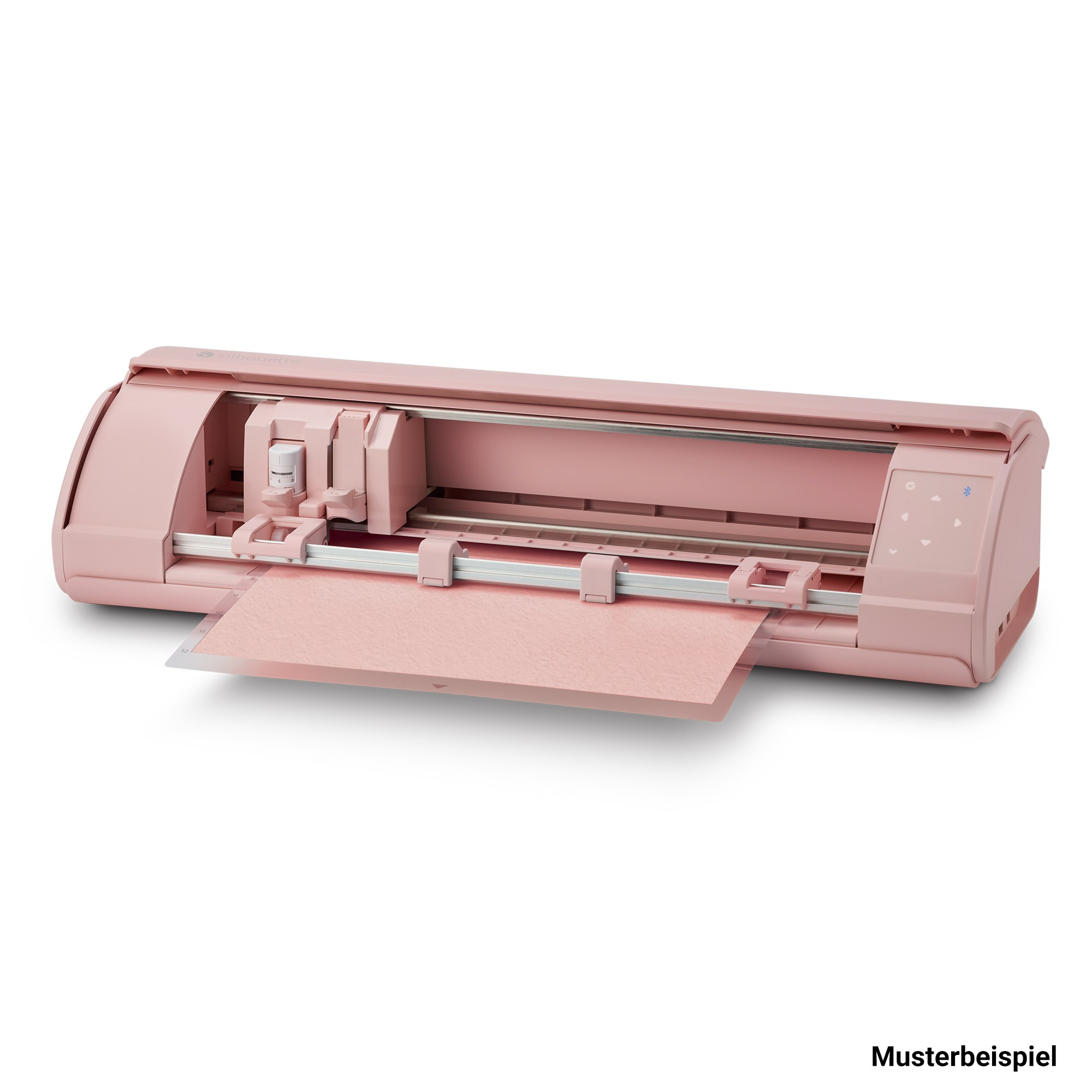 Une machine de découpe rose avec une feuille de papier s'étendant de l'avant.