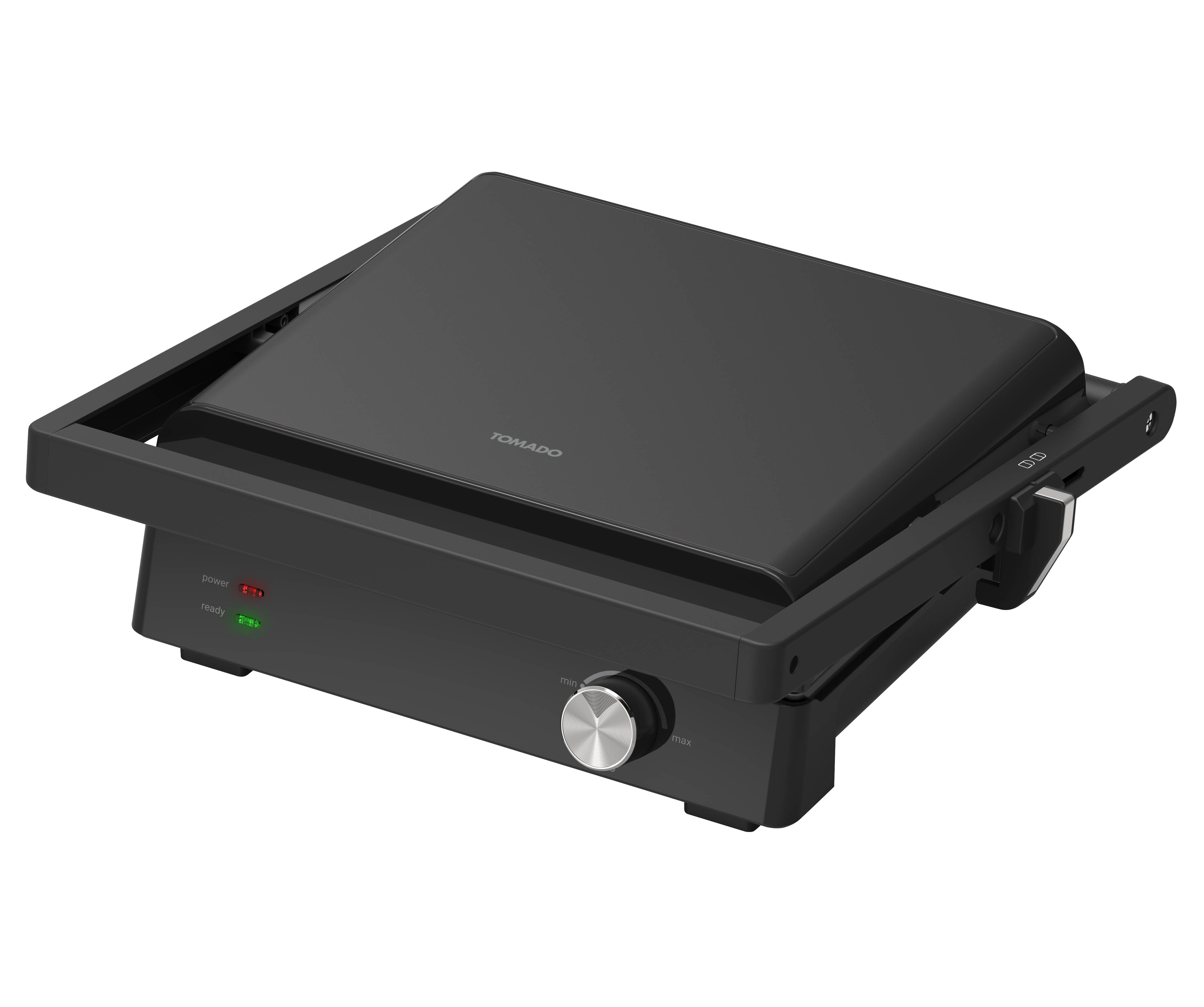A black panini press with a closed lid, ready and power indicators, and a control dial, on white.
