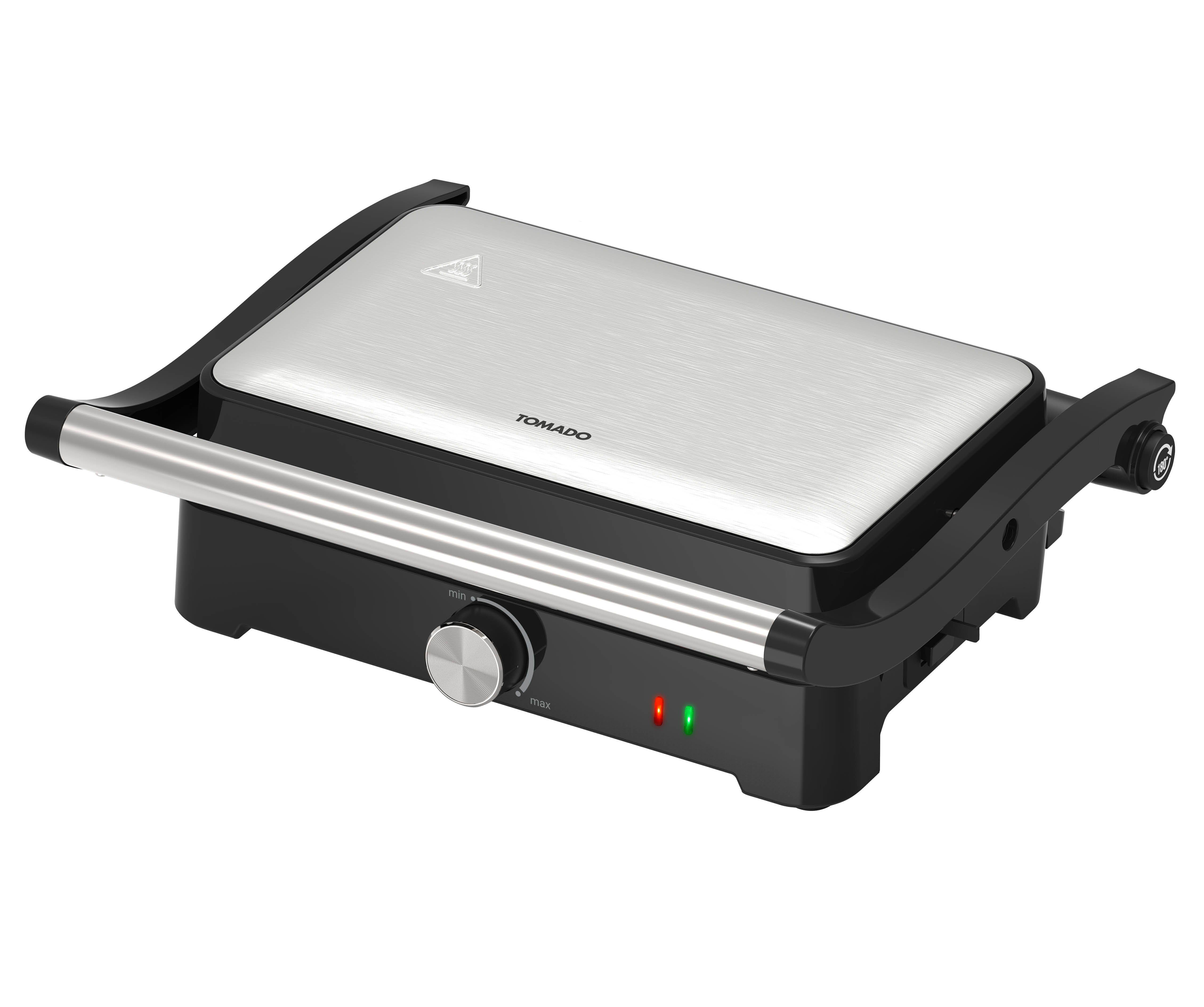 A black and silver Tomado panini press with a brushed metal surface and a dial.