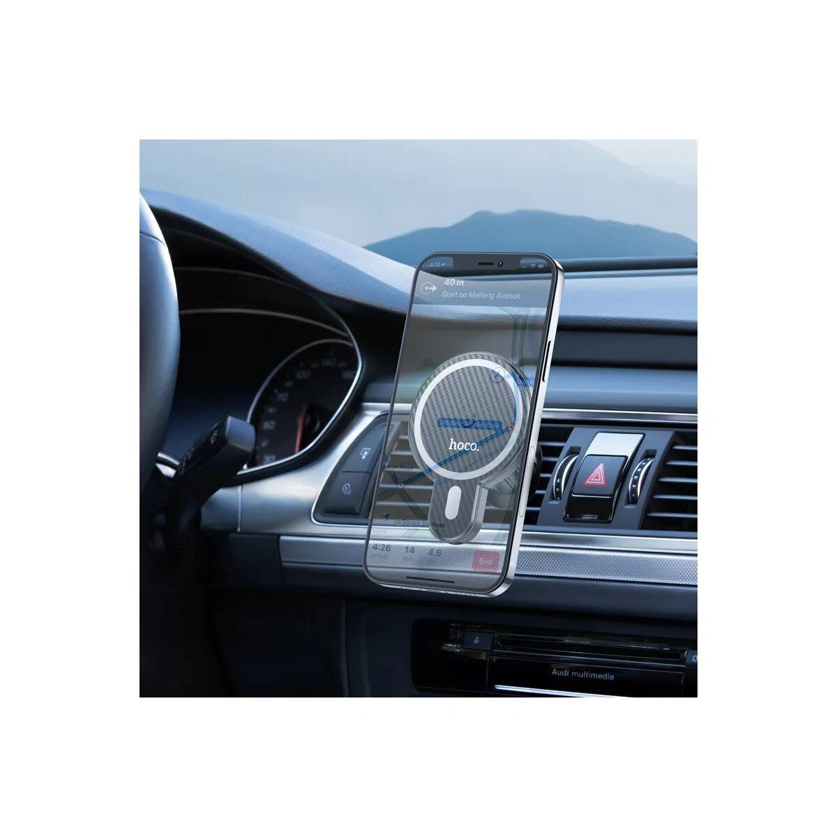 Ein Telefon mit einem kreisförmigen Ladegerät ist auf dem Armaturenbrett eines Autos in der Nähe der Lüftungsschlitze montiert.