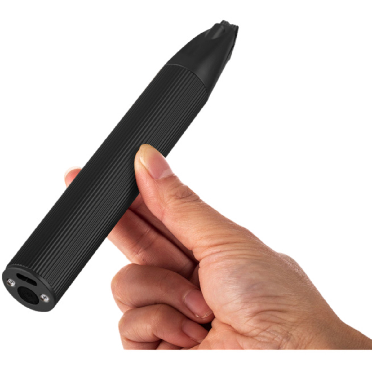 A black, ribbed device is held in a hand. The device has a pointed end and small circular openings at the bottom.