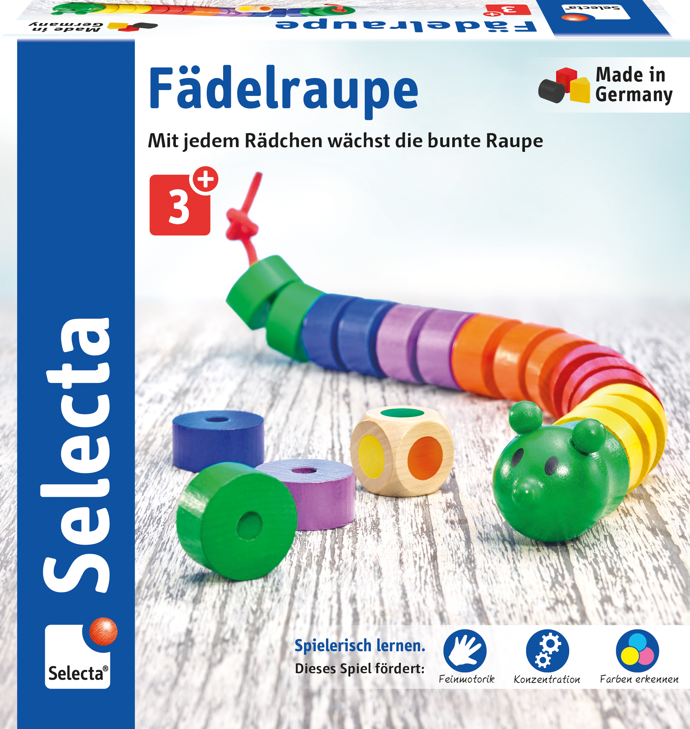 Ein Holzspielzeug mit bunten Holzringen und einem grünen Bären. Auf Holzoberfläche.