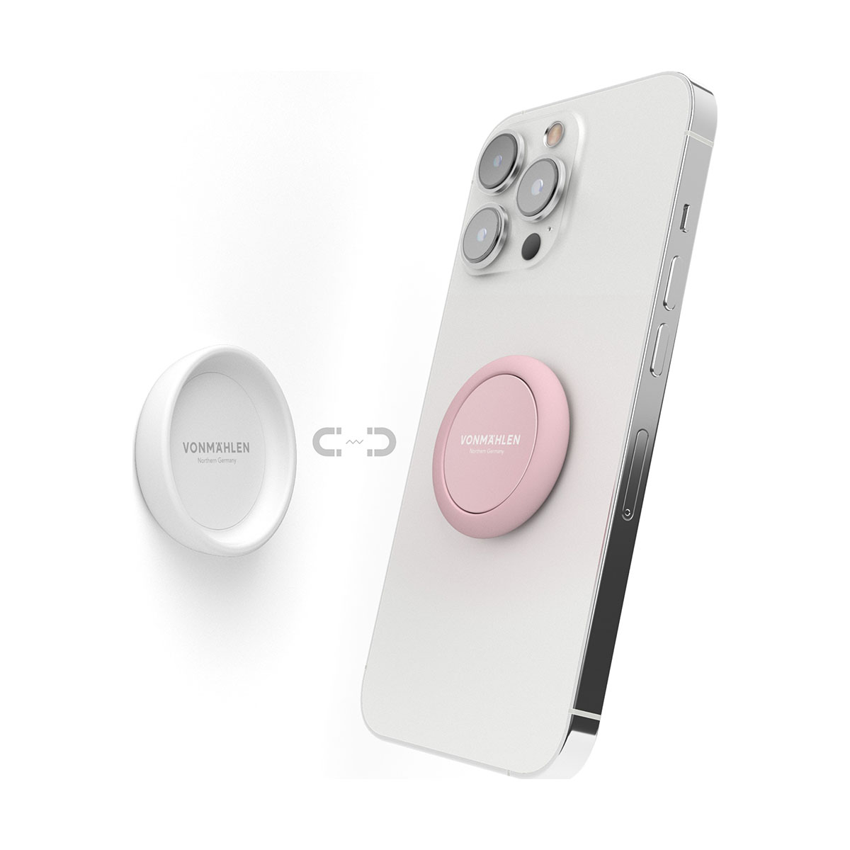 Un'impugnatura rosa per telefono attaccata magneticamente a un telefono bianco. Un supporto bianco è vicino.