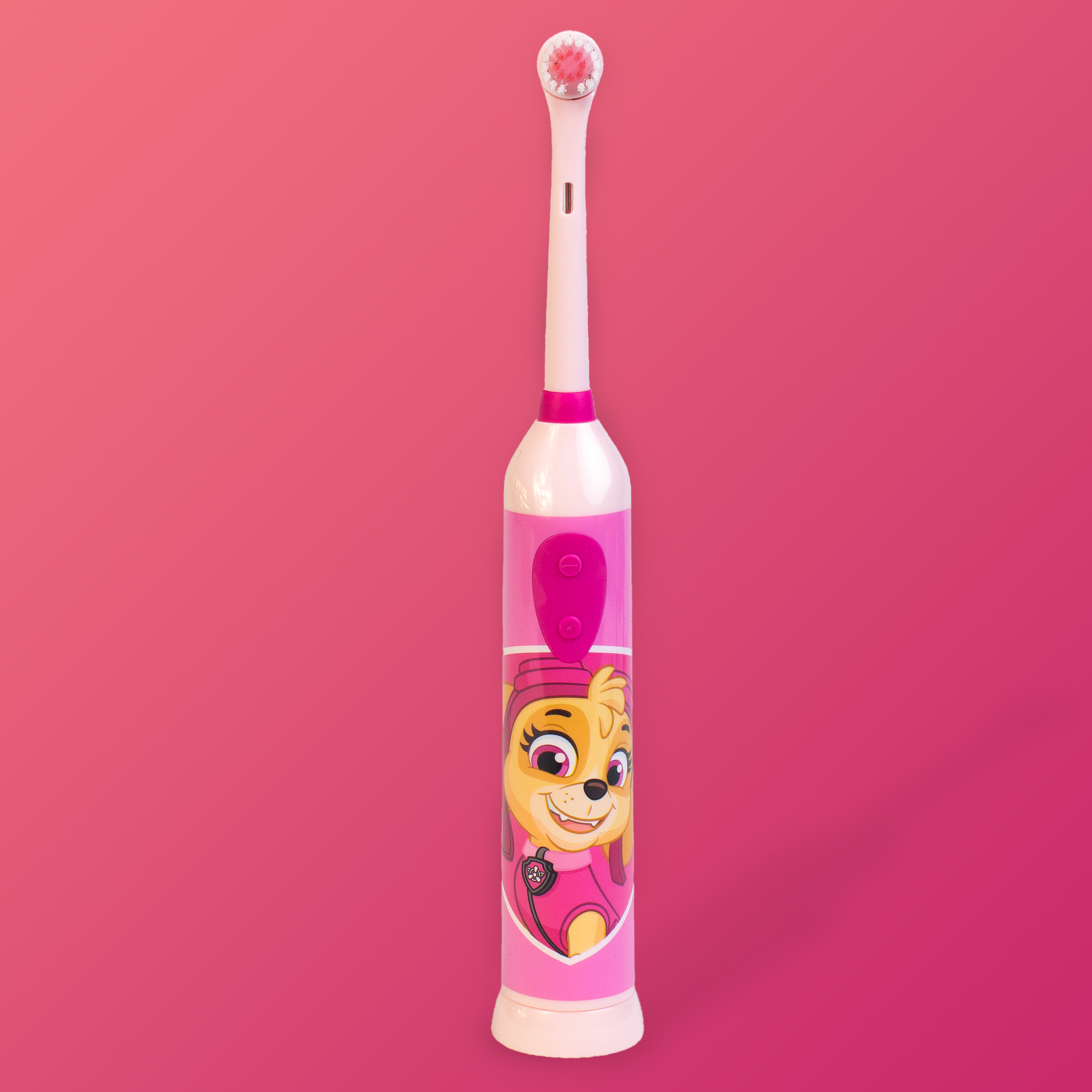 Eine rosa-weiße elektrische Zahnbürste mit einer Cartoonfigur darauf.