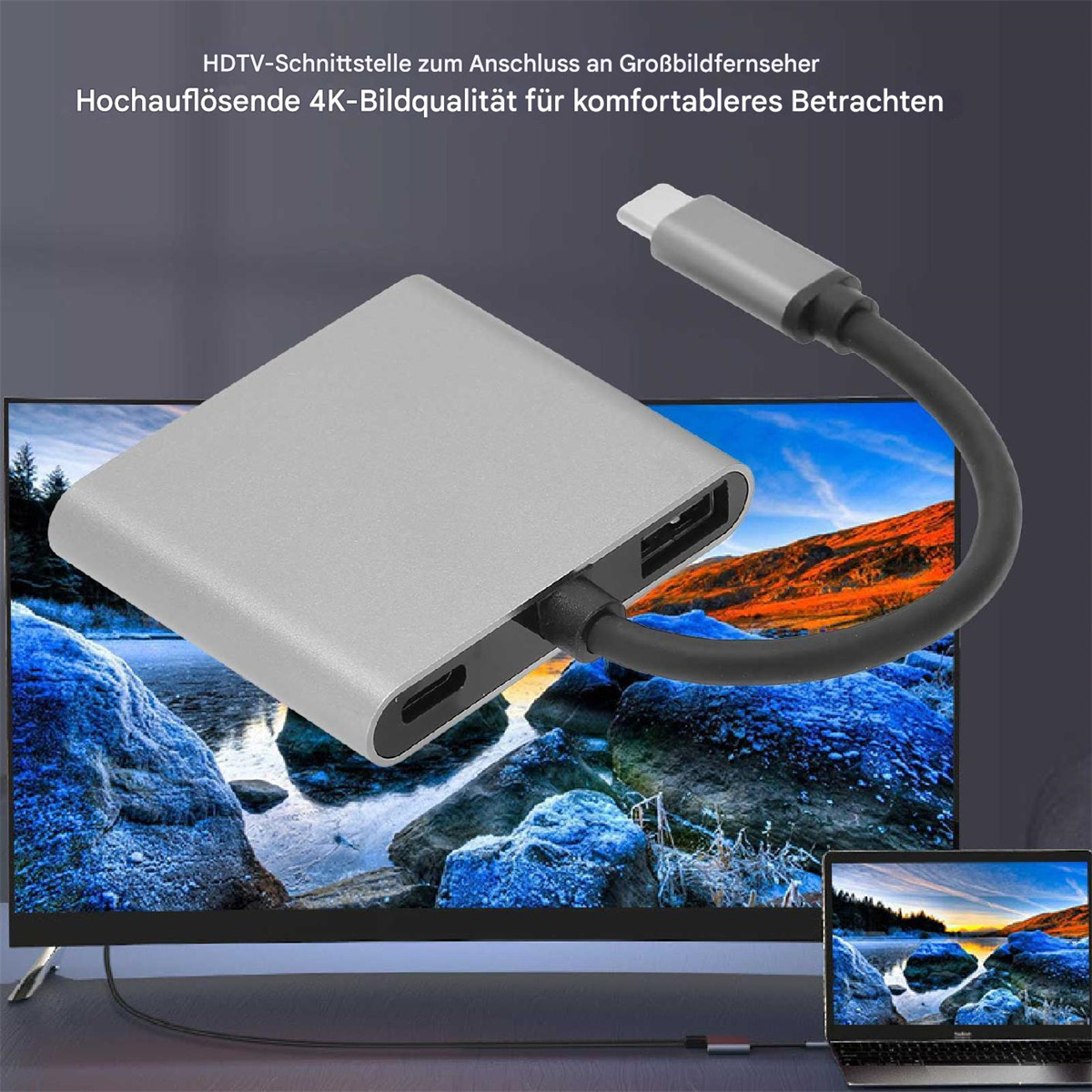 Ein silberner Adapter, der an einen Fernseher und einen Laptop angeschlossen ist.