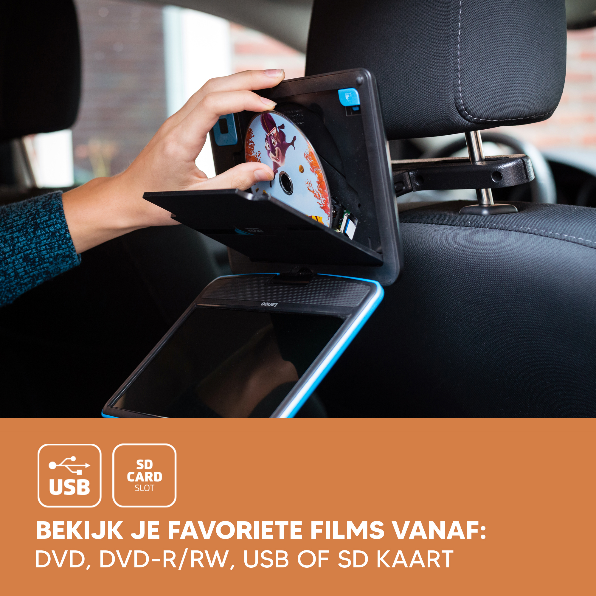 A person inserting a CD into a car DVD player. The screen is blue, showing a film.