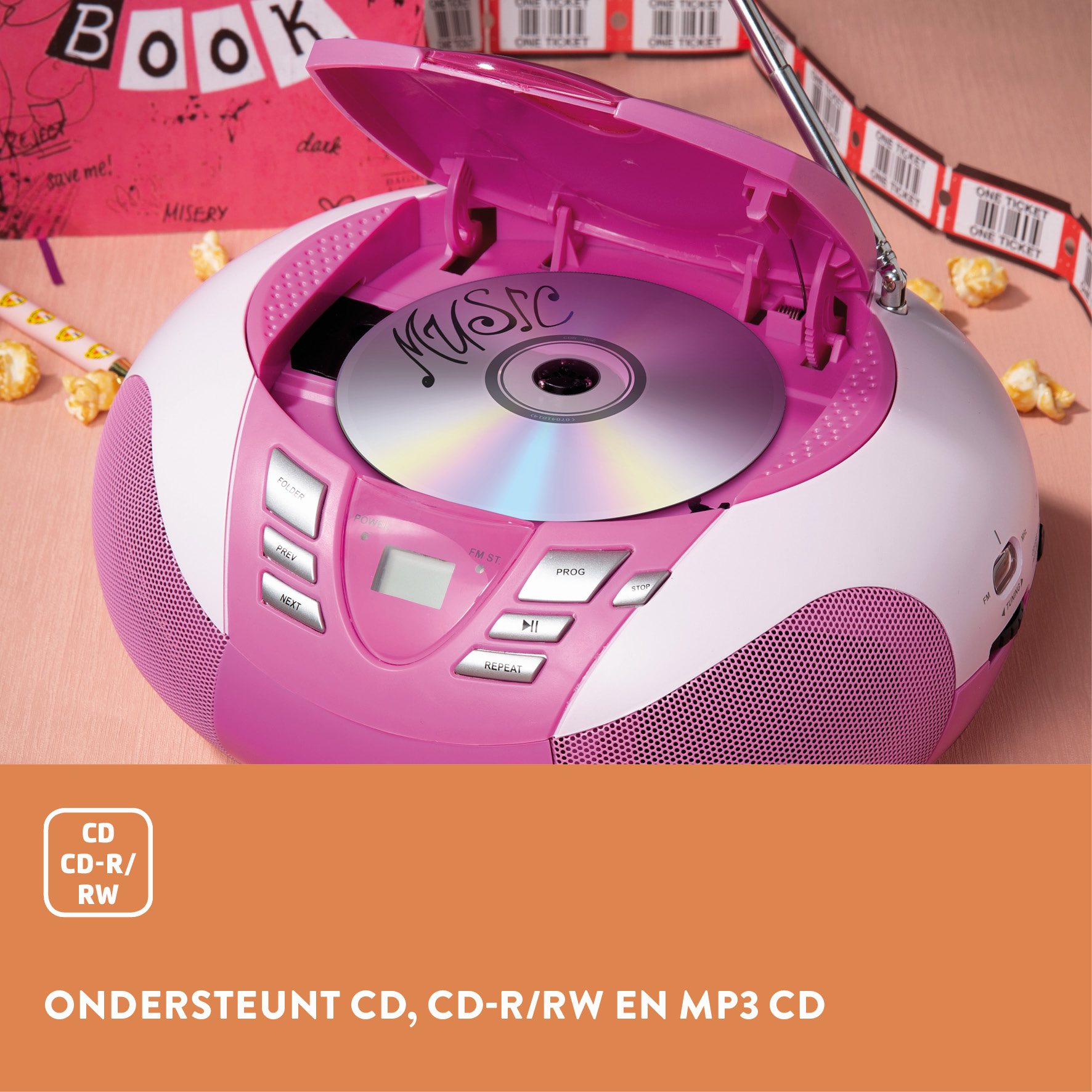 A pink and white CD player with a CD inside. A book and popcorn are in the background.