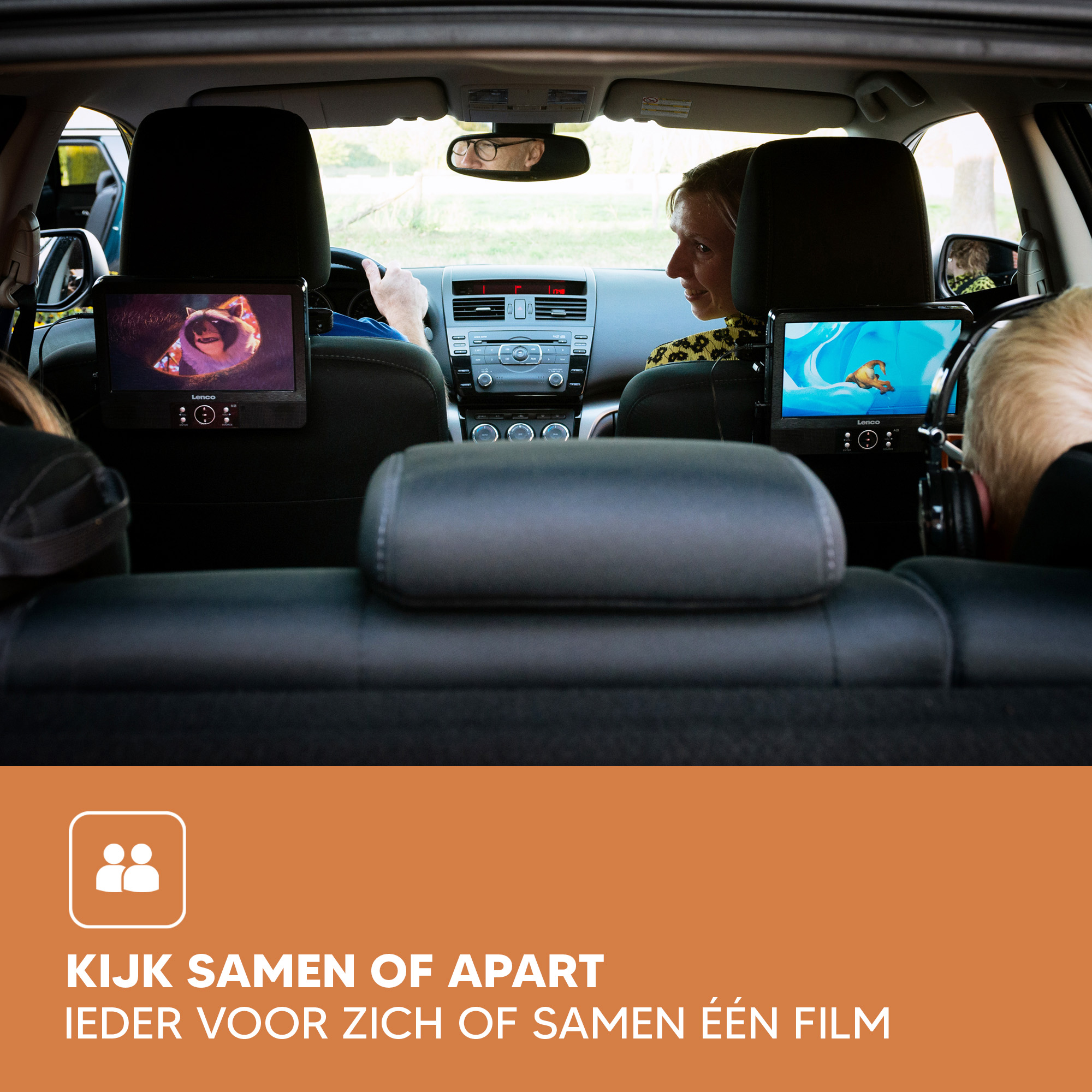 People watching movies on screens attached to car headrests, in a car.