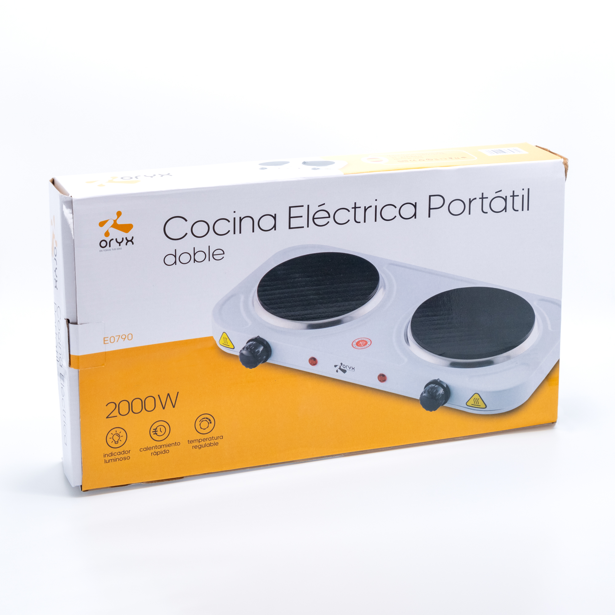 Una placa de cocina eléctrica portátil doble en una caja. Tiene dos quemadores y perillas de control.