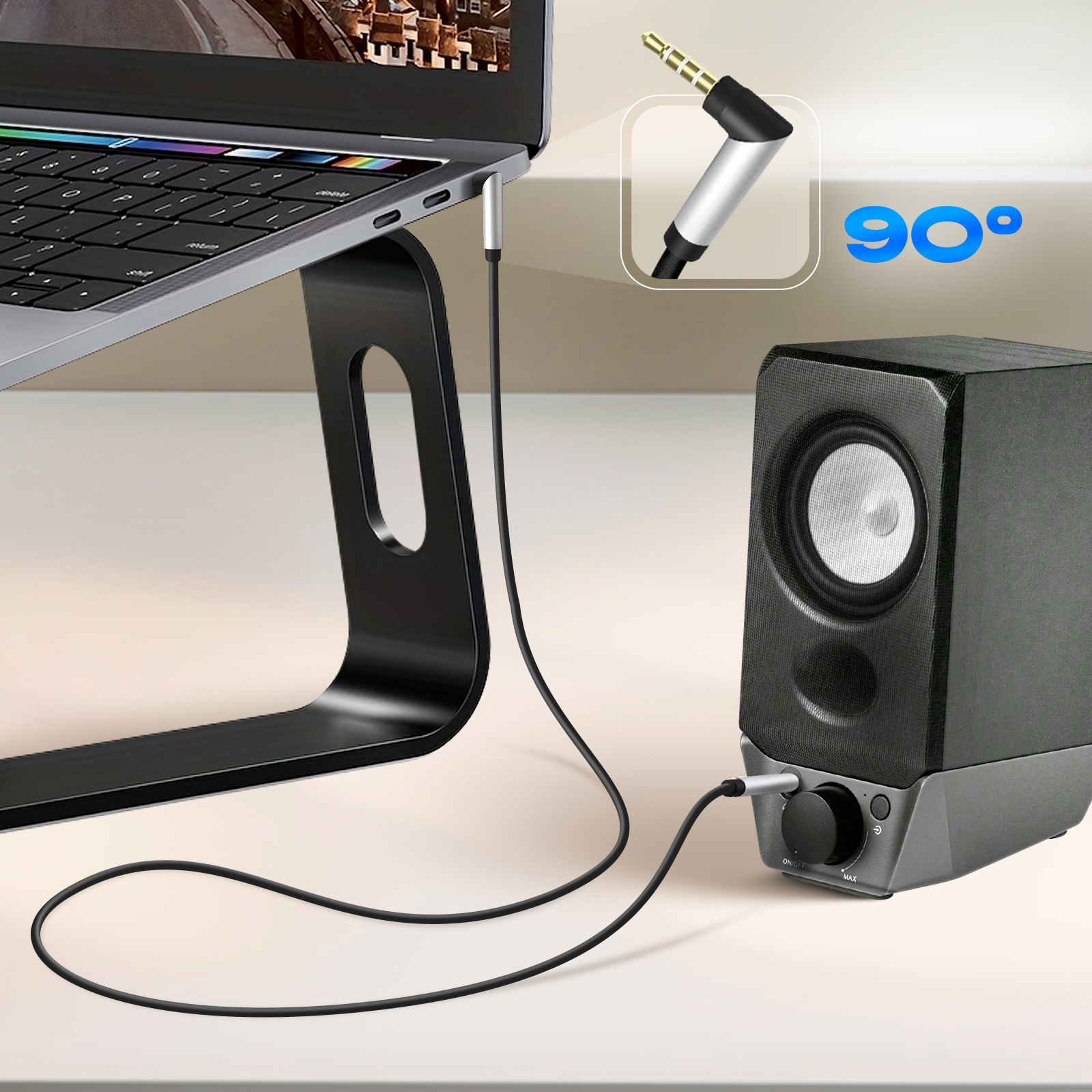 Una computadora portátil conectada a un altavoz mediante un cable negro. Se muestra un enchufe en ángulo de 90 grados.