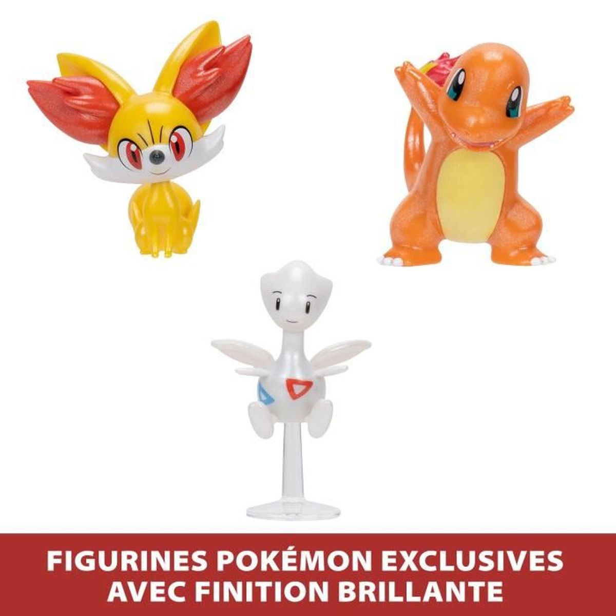 Drei Pokémon-Figuren: Fynx, Glumanda und Togepi, auf einer weißen Oberfläche.