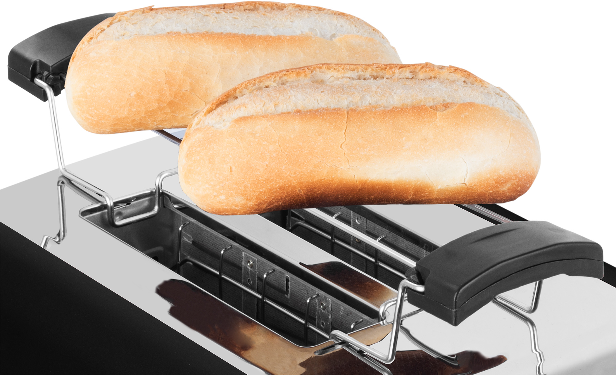Dwie bułki w tosterze. Błyszczący toster ze stali nierdzewnej.