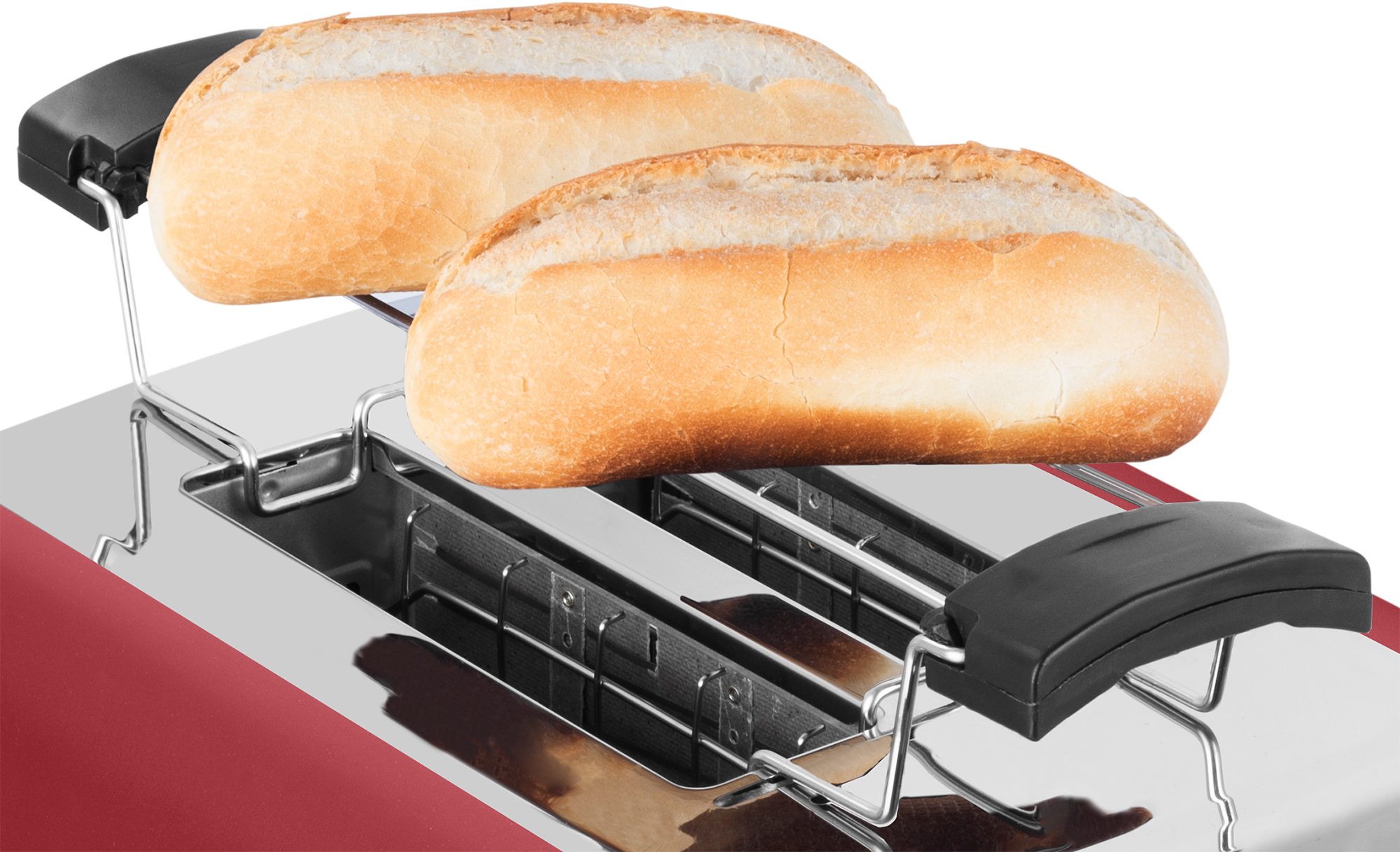 Toster z dwoma bułkami na wierzchu, gotowymi do tostowania. Widoczny jest czerwony toster.