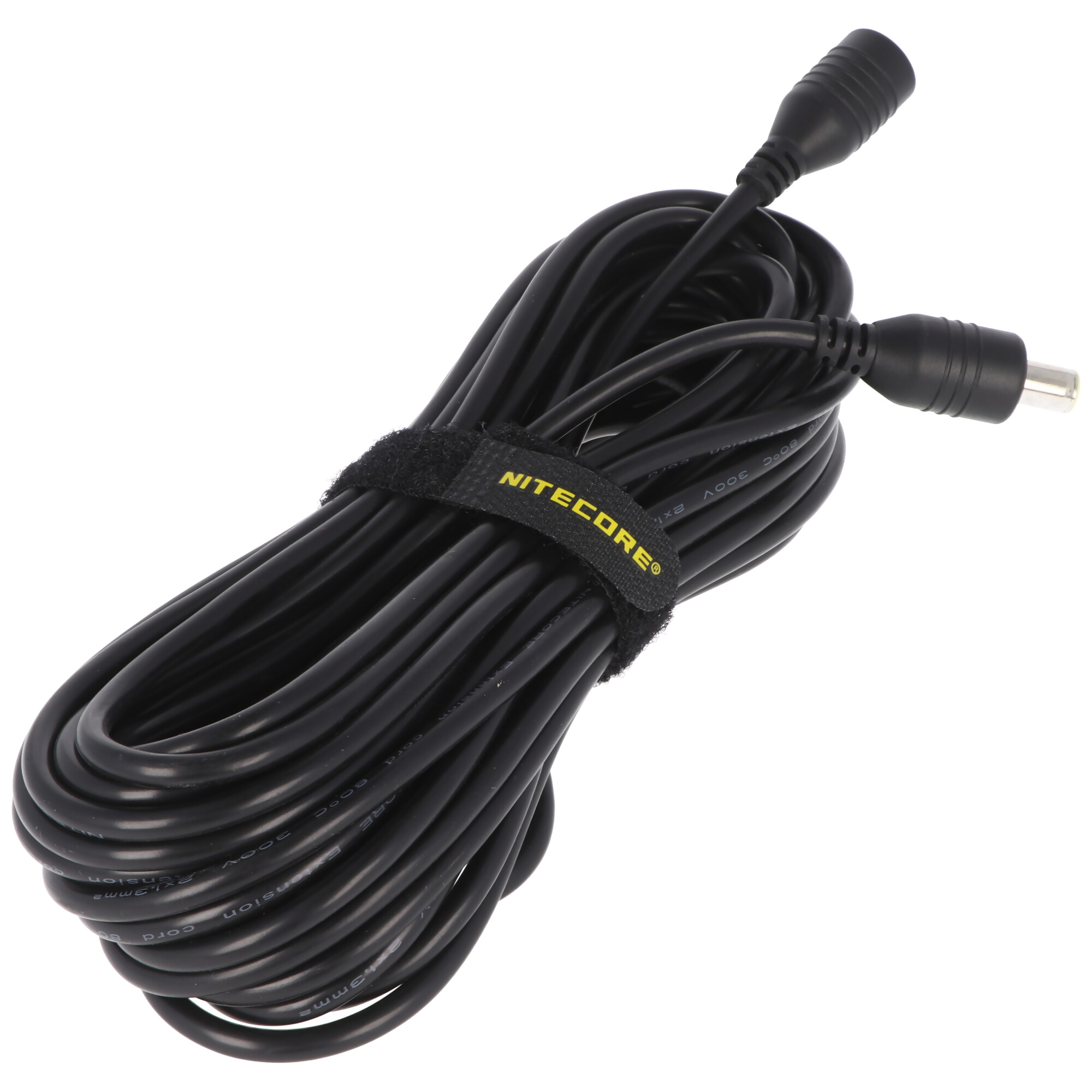 A coiled black cable with a Nitecore logo on a velcro strap. Two black connectors at each end. 