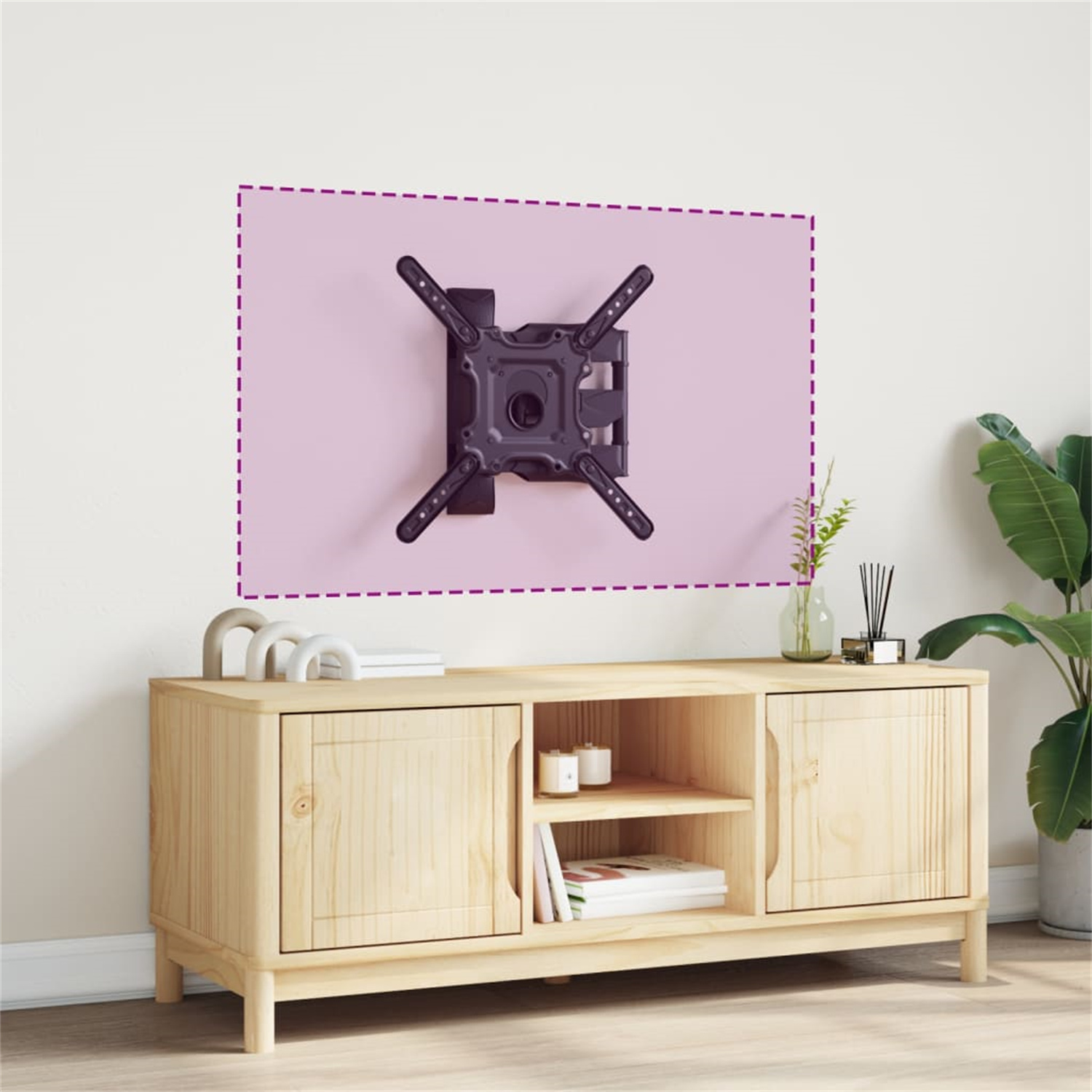 TV-Halterung an einer rosa Wand über einem Holzschrank. Im Hintergrund ist eine Pflanze.