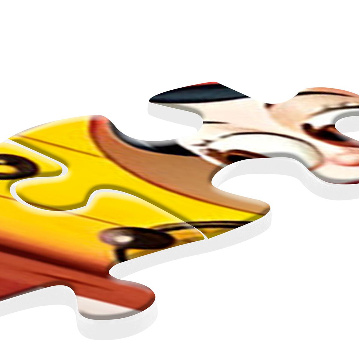 Primo piano di pezzi di puzzle. Pezzi gialli e arancioni. Sfondo bianco e messa a fuoco morbida.