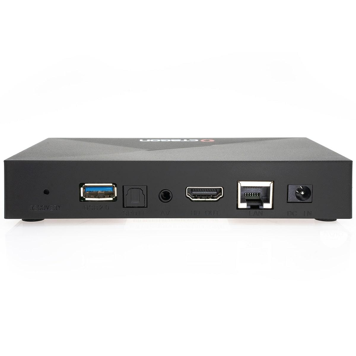 Eine schwarze Set-Top-Box mit verschiedenen Anschlüssen: USB, optisch, HDMI, LAN und DC. Ein weißer Hintergrund.