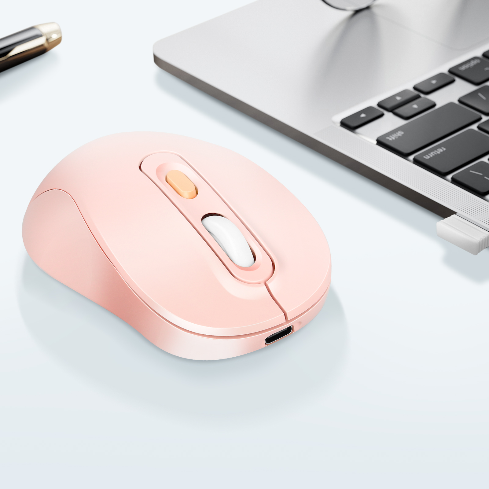 Rosa kabellose Maus. Hat orange Scrollrad und Tasten und ein weißes Scrollrad.