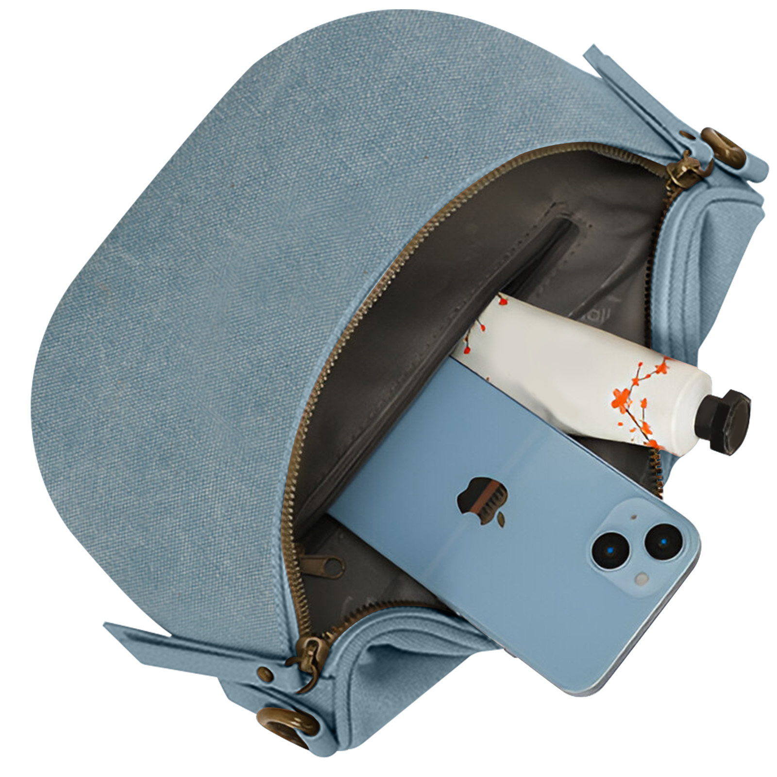 Bolso azul con un teléfono y un tubo de maquillaje dentro.